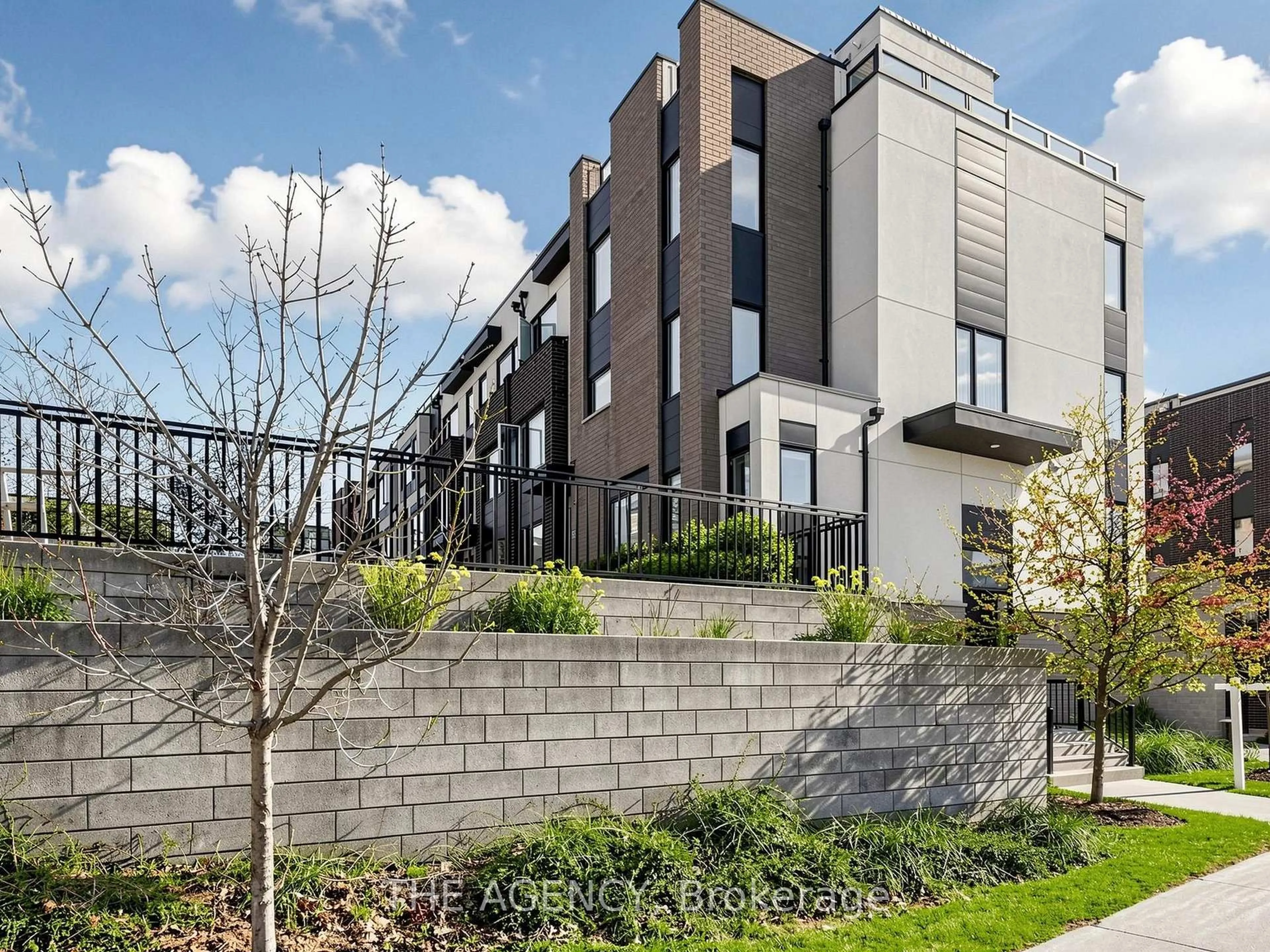 A pic from outside/outdoor area/front of a property/back of a property/a pic from drone, street for 55 Thomas Mulholland Dr #1, Toronto Ontario M3K 0A7