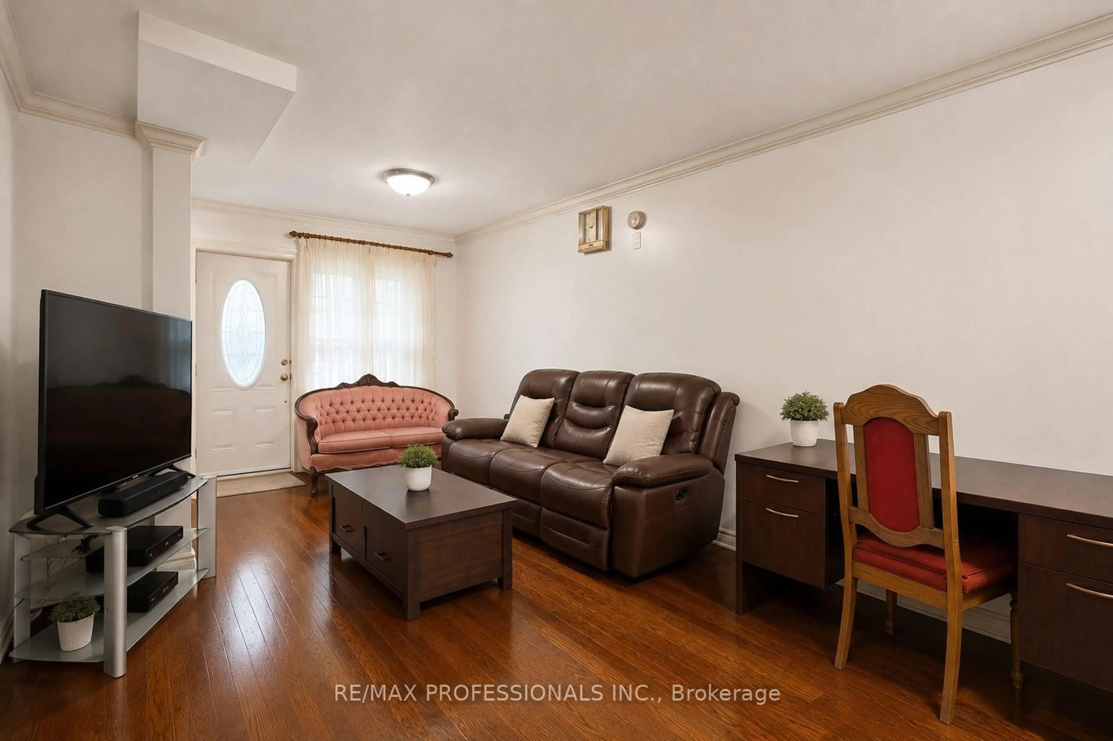 Living room with furniture, wood/laminate floor for 166 Caledonia Rd, Toronto Ontario M6E 4S7