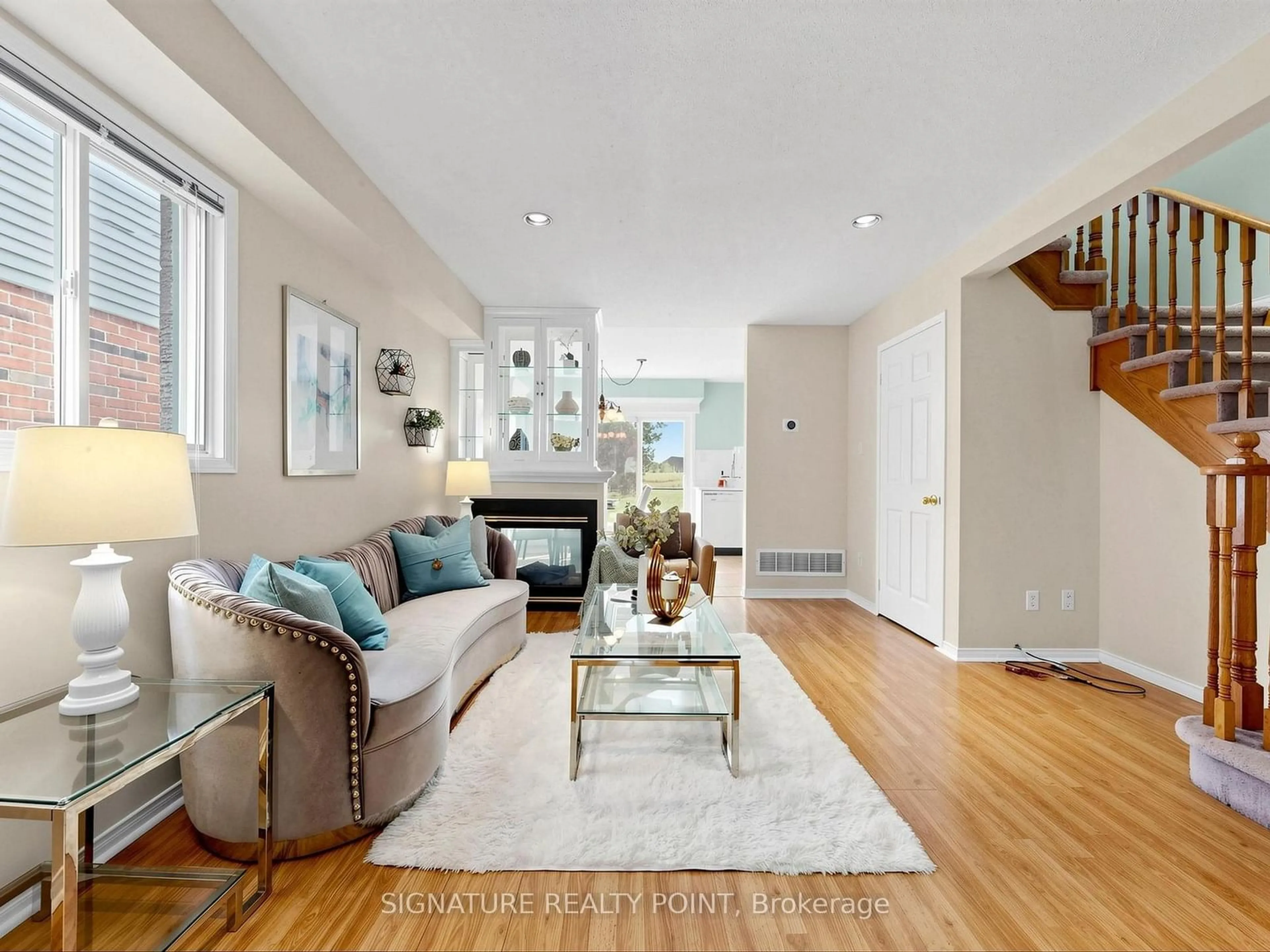 Living room with furniture, wood/laminate floor for 1816 Hobson Dr, Burlington Ontario L7L 6L7