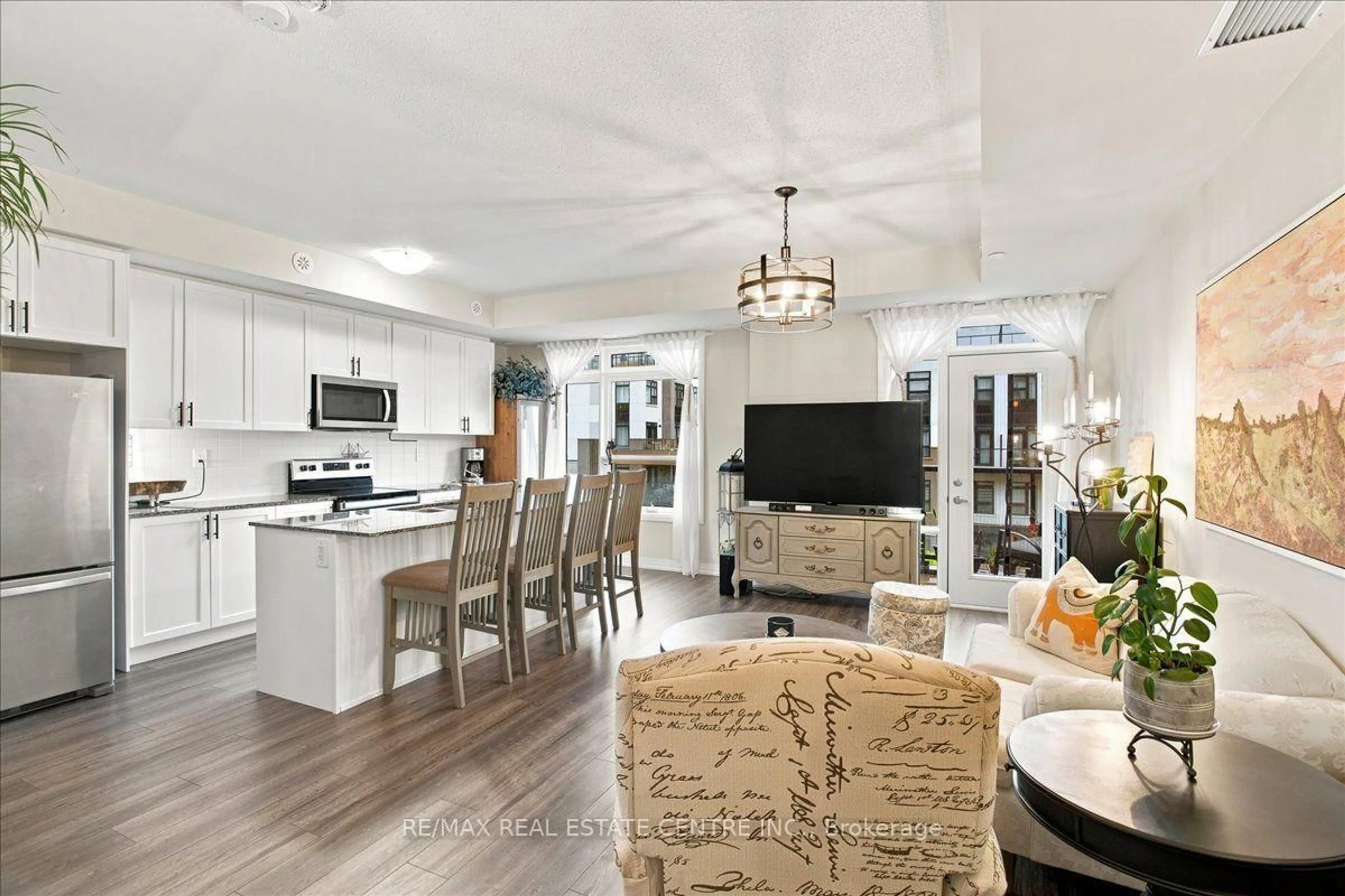 Open concept kitchen, ceramic/tile floor for 1597 Rose Way #103, Milton Ontario L9E 1N4