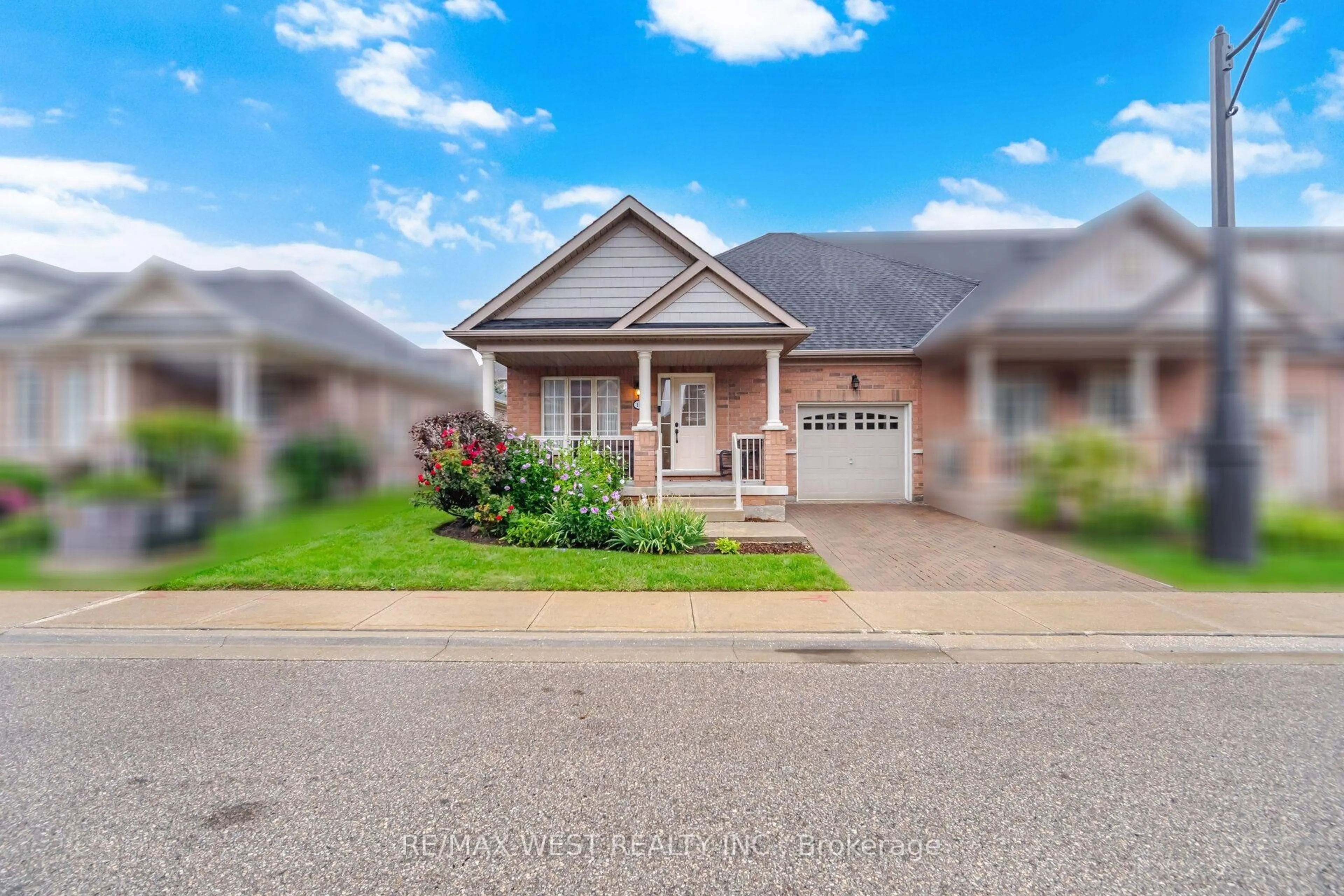 Home with brick exterior material, street for 12 Muzzo Dr, Brampton Ontario L6R 3W8