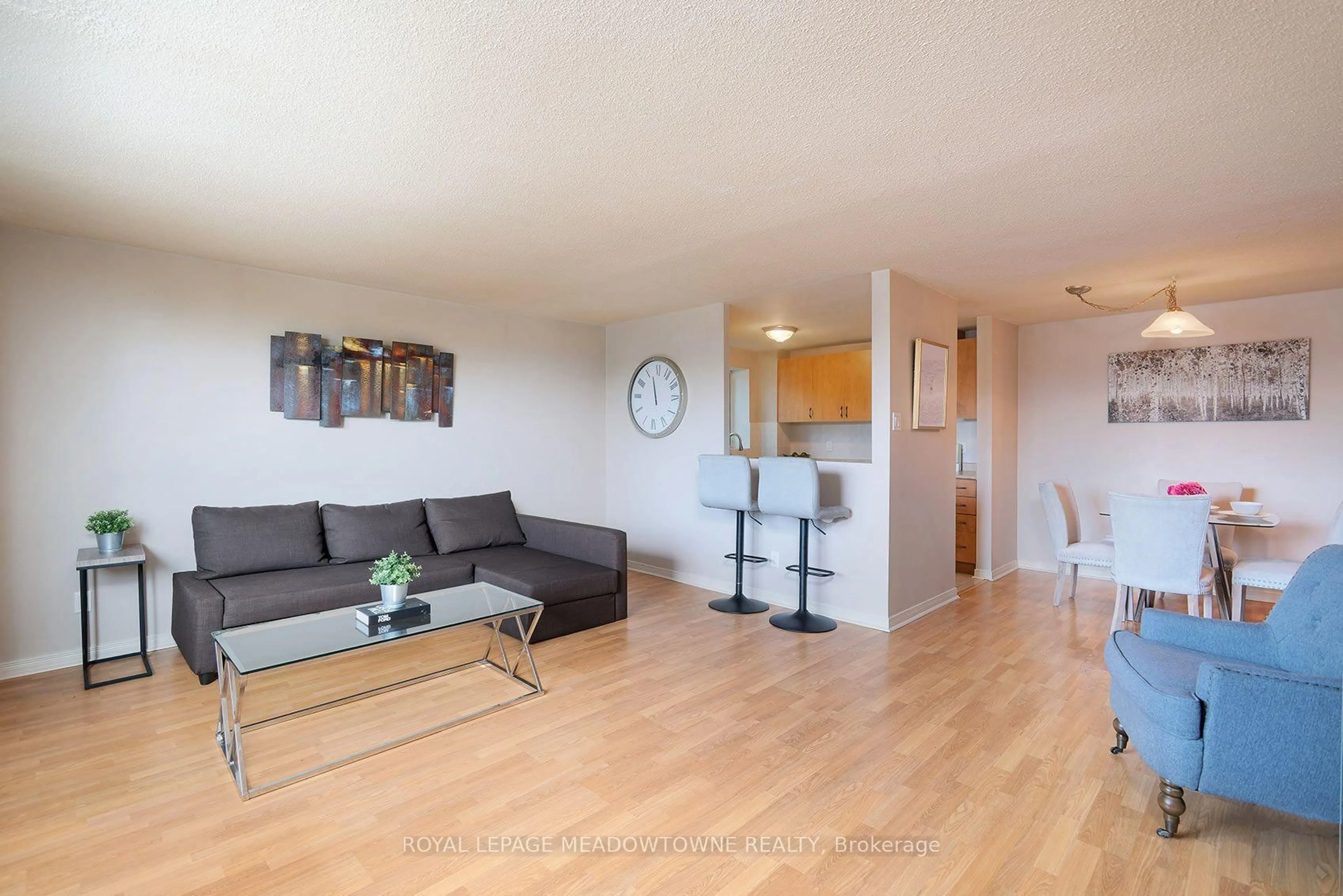 Living room with furniture, wood/laminate floor for 6720 Glen Erin Dr #206, Mississauga Ontario L5N 3K8