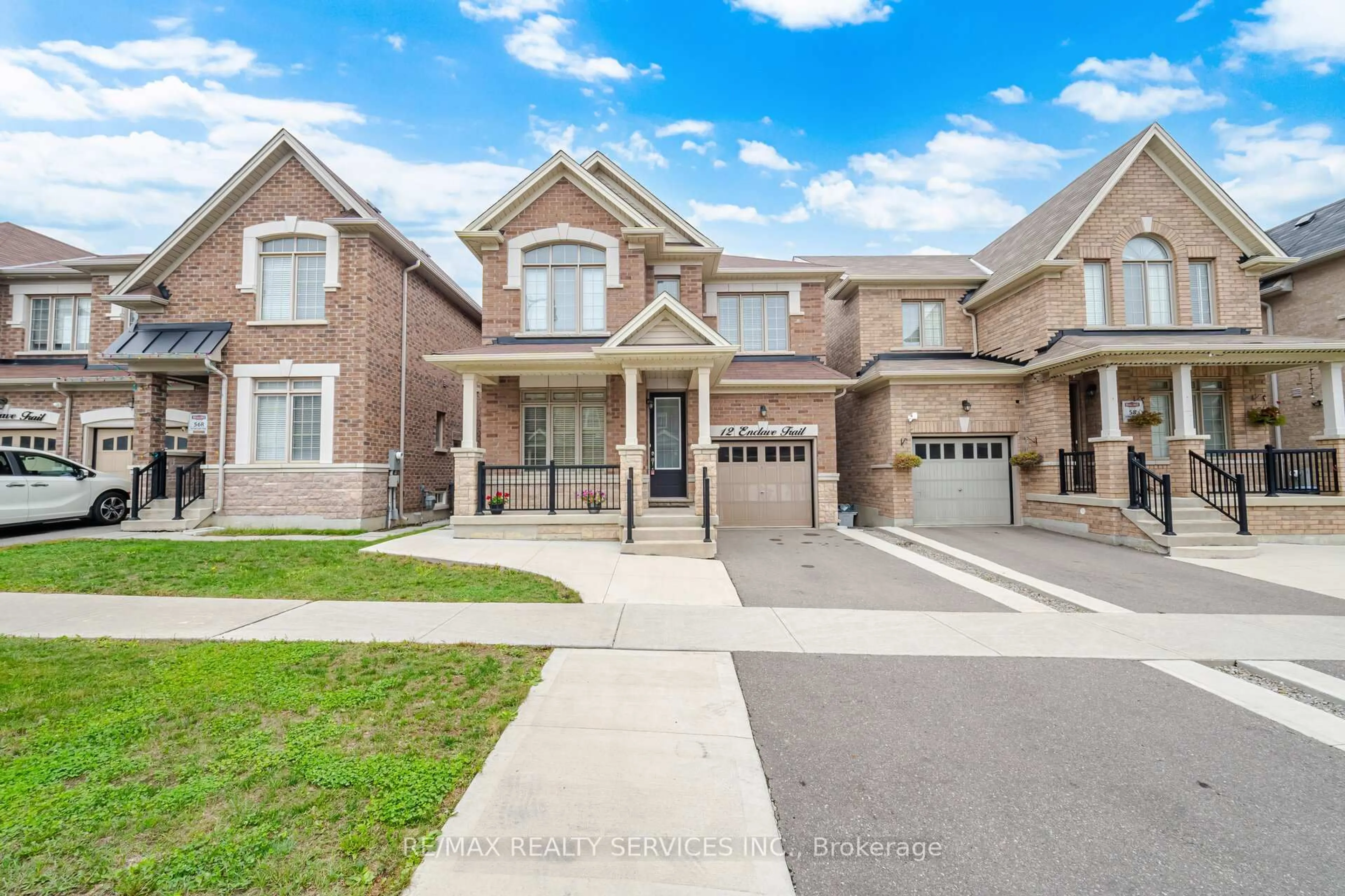 Home with brick exterior material, street for 12 Enclave Tr, Brampton Ontario L6R 4B3