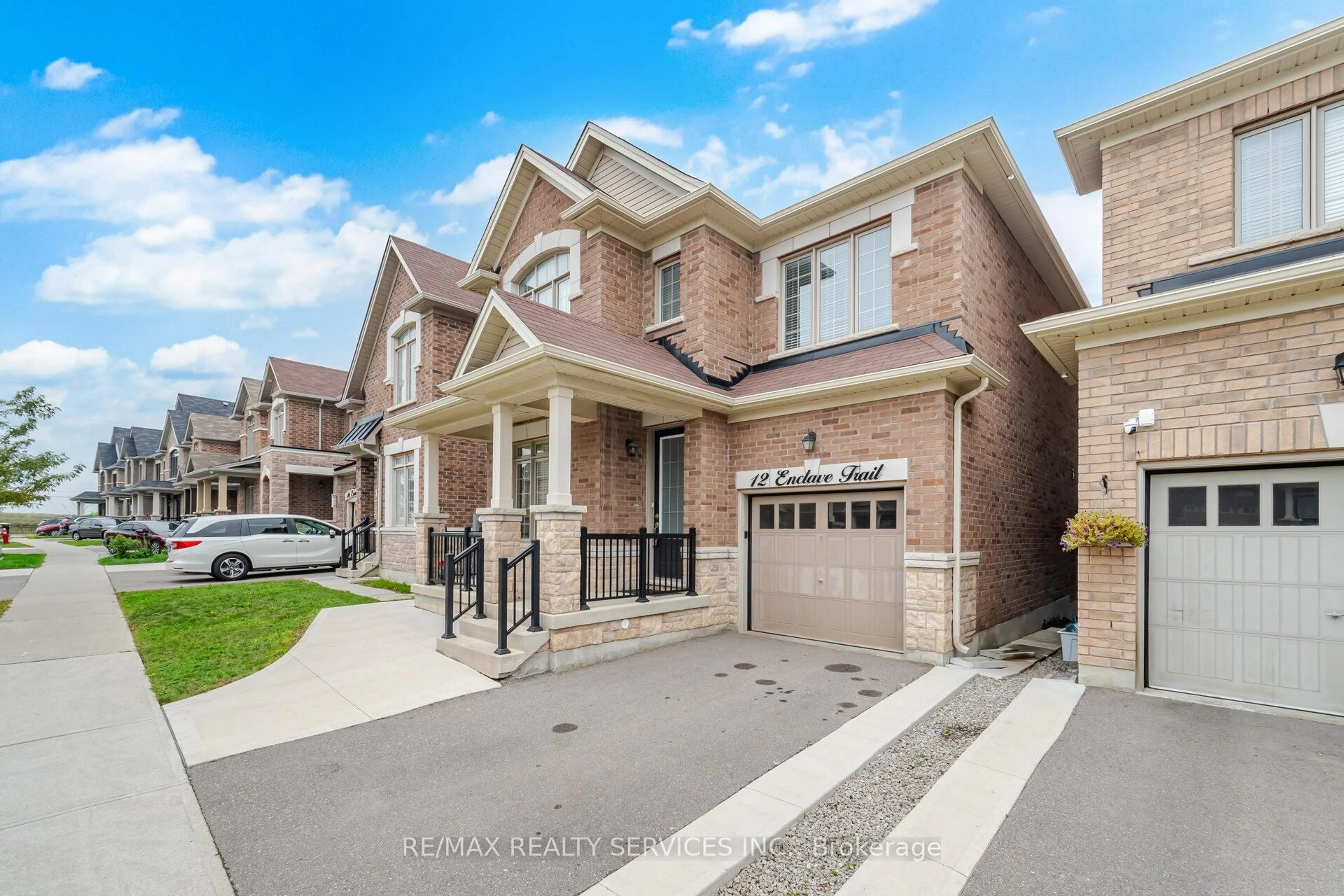 Home with brick exterior material, street for 12 Enclave Tr, Brampton Ontario L6R 4B3