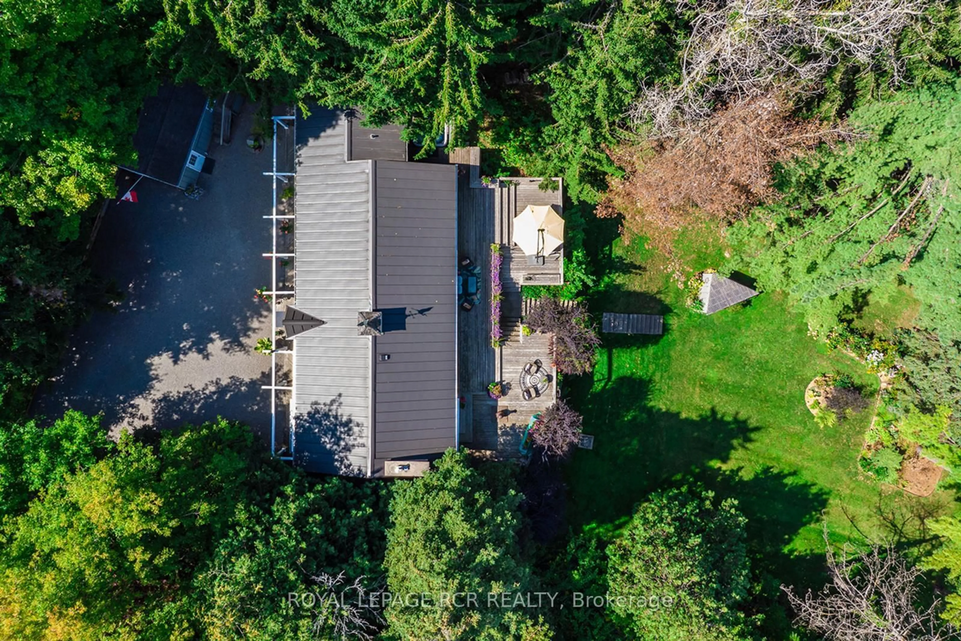 A pic from outside/outdoor area/front of a property/back of a property/a pic from drone, forest/trees view for 114 Kennedy Rd, Caledon Ontario L7C 2A7