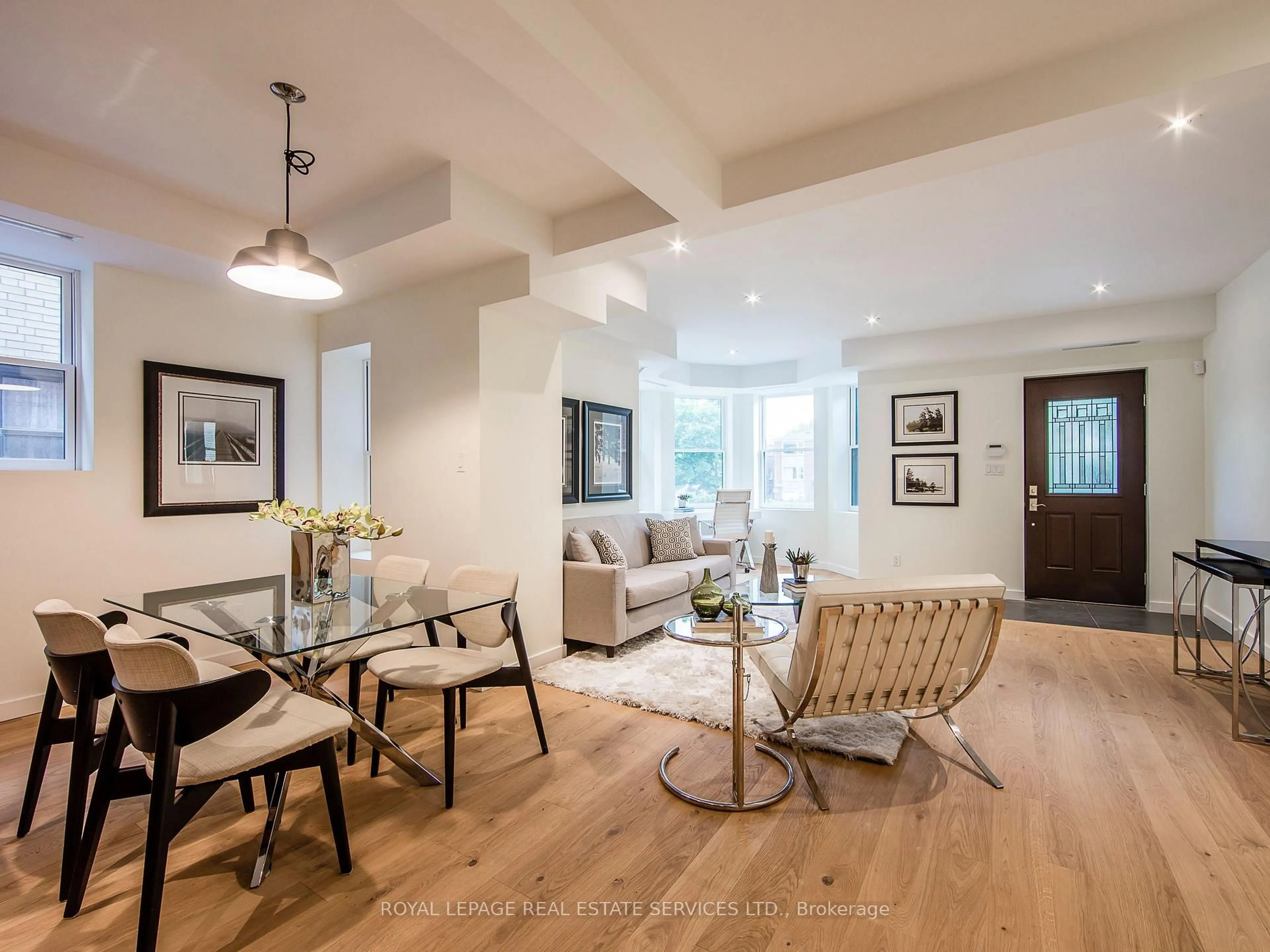 Living room with furniture, wood/laminate floor for 137 High Park Ave, Toronto Ontario M6P 2S3