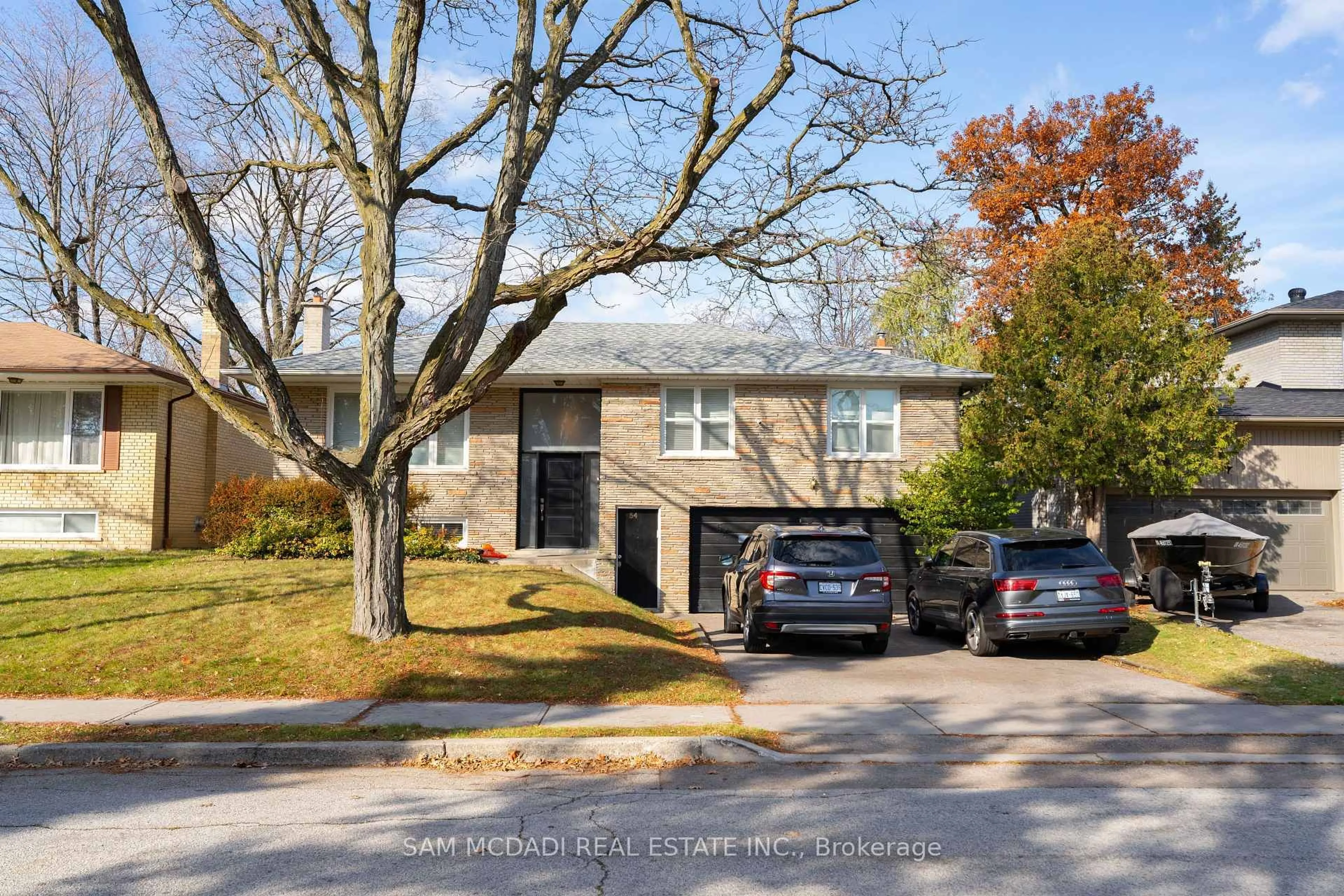 Home with brick exterior material, street for 54 Bearbury Dr, Toronto Ontario M9C 2G9
