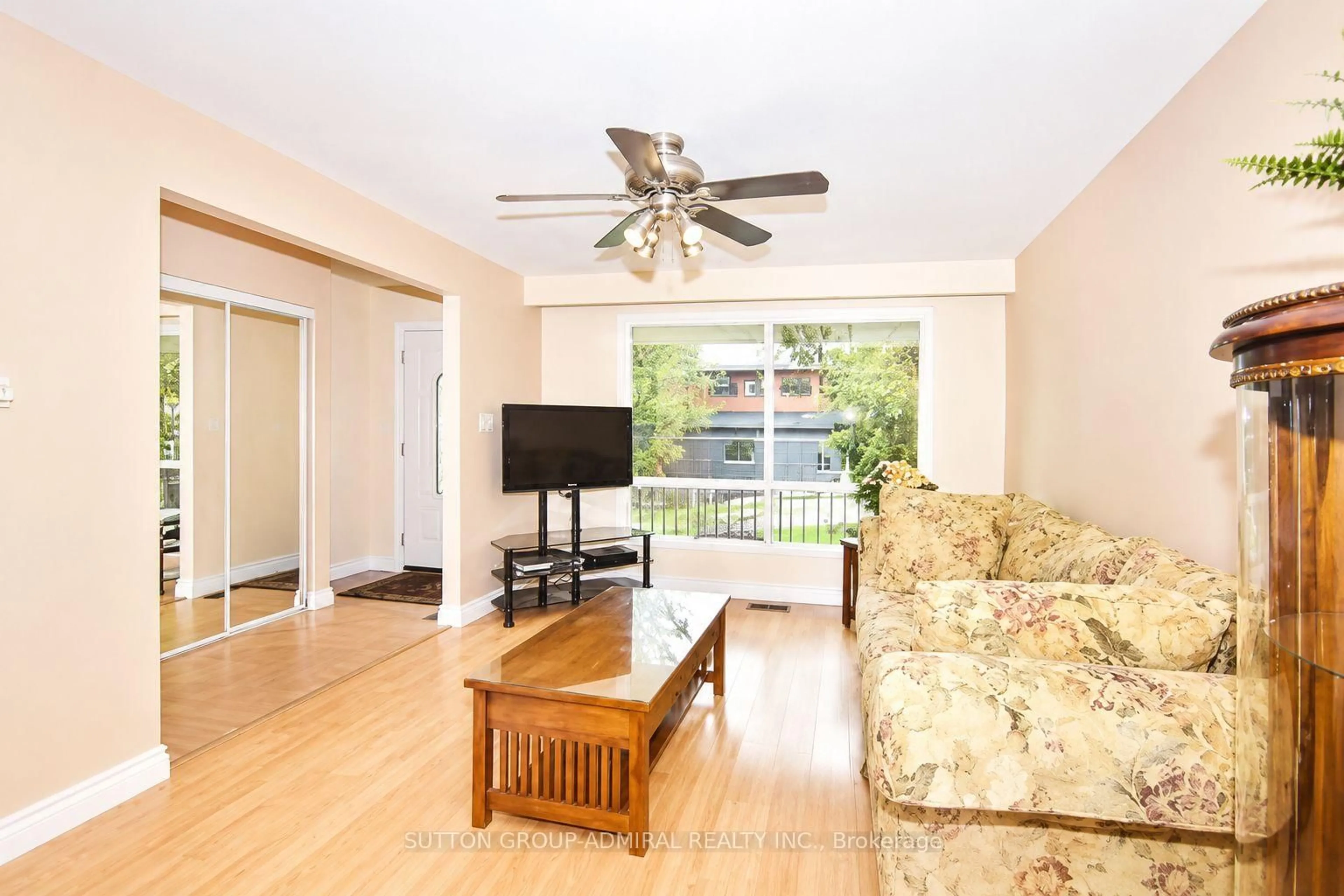 Living room with furniture, wood/laminate floor for 94 Sackville St, Caledon Ontario L7E 1B8