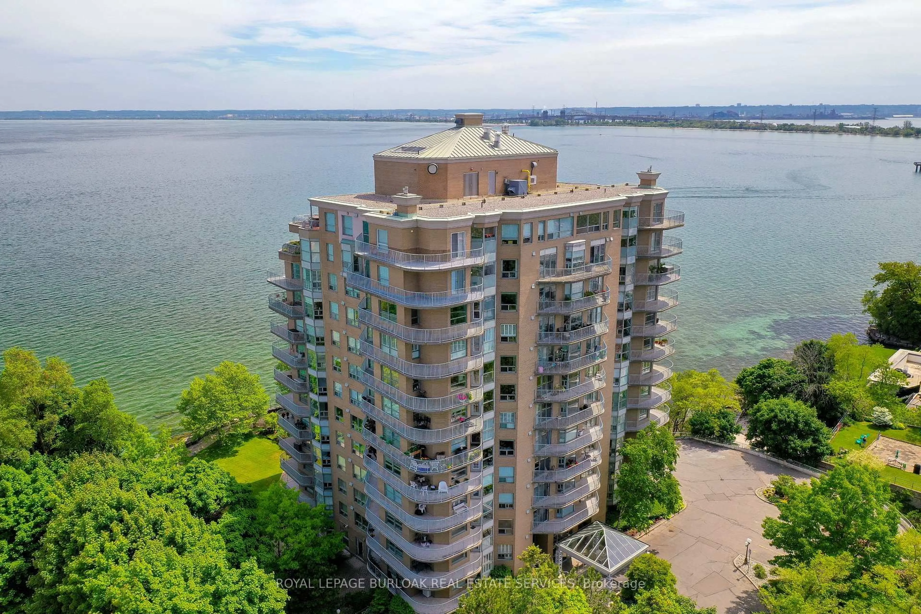 A pic from outside/outdoor area/front of a property/back of a property/a pic from drone, water/lake/river/ocean view for 2190 Lakeshore Rd #304, Burlington Ontario L7R 4K1