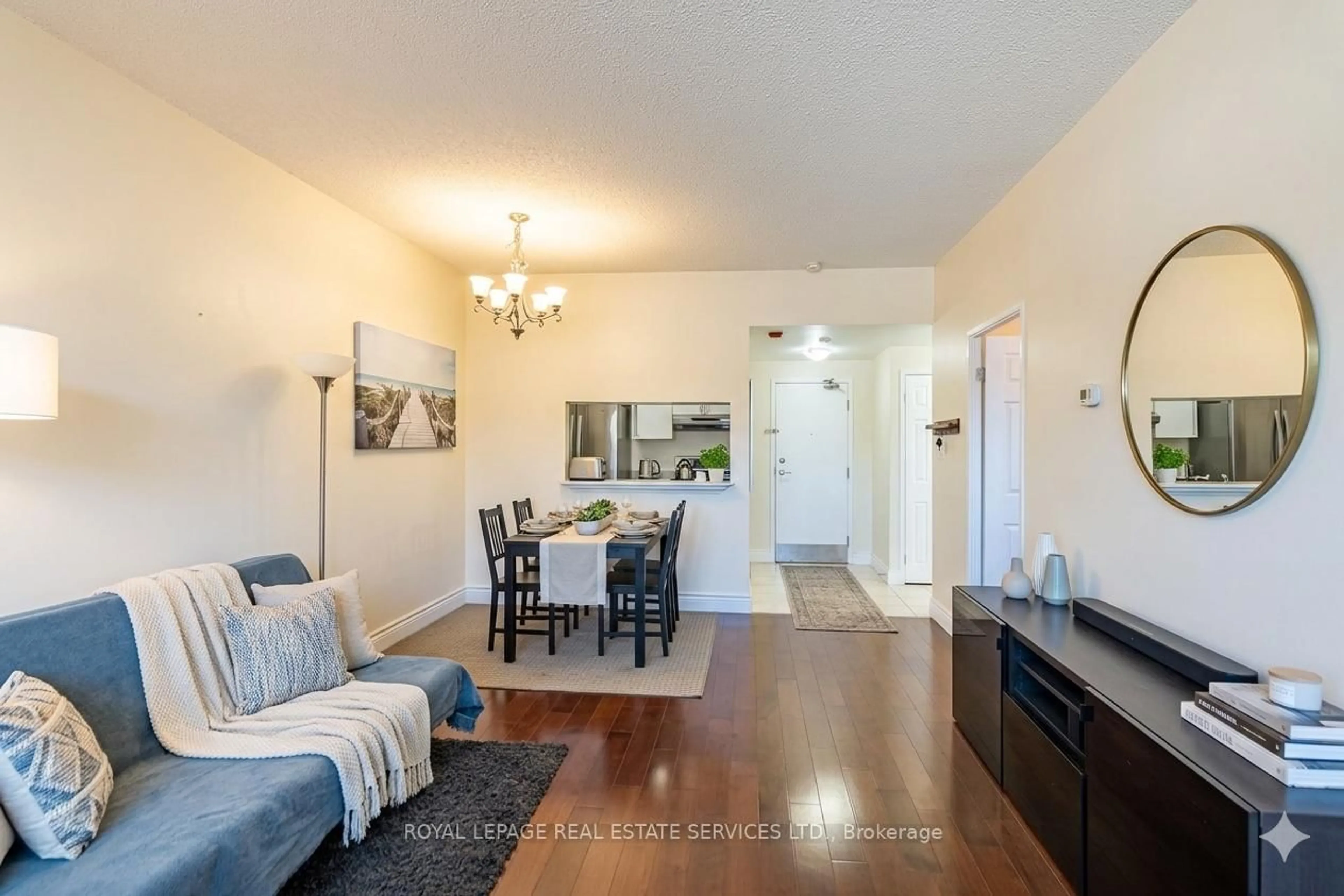 Living room with furniture, wood/laminate floor for 8351 McLaughlin Rd #141, Brampton Ontario L6Y 4H8