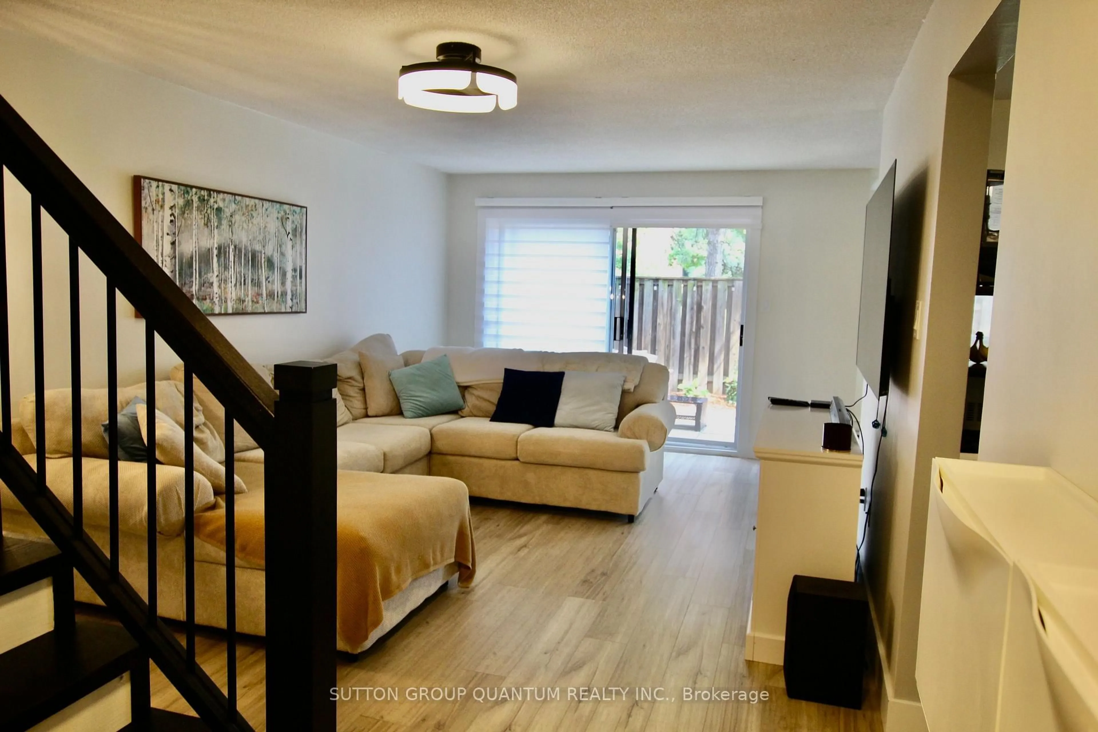 Living room with furniture, wood/laminate floor for 6777 Formentera Ave #42, Mississauga Ontario L5N 2M3