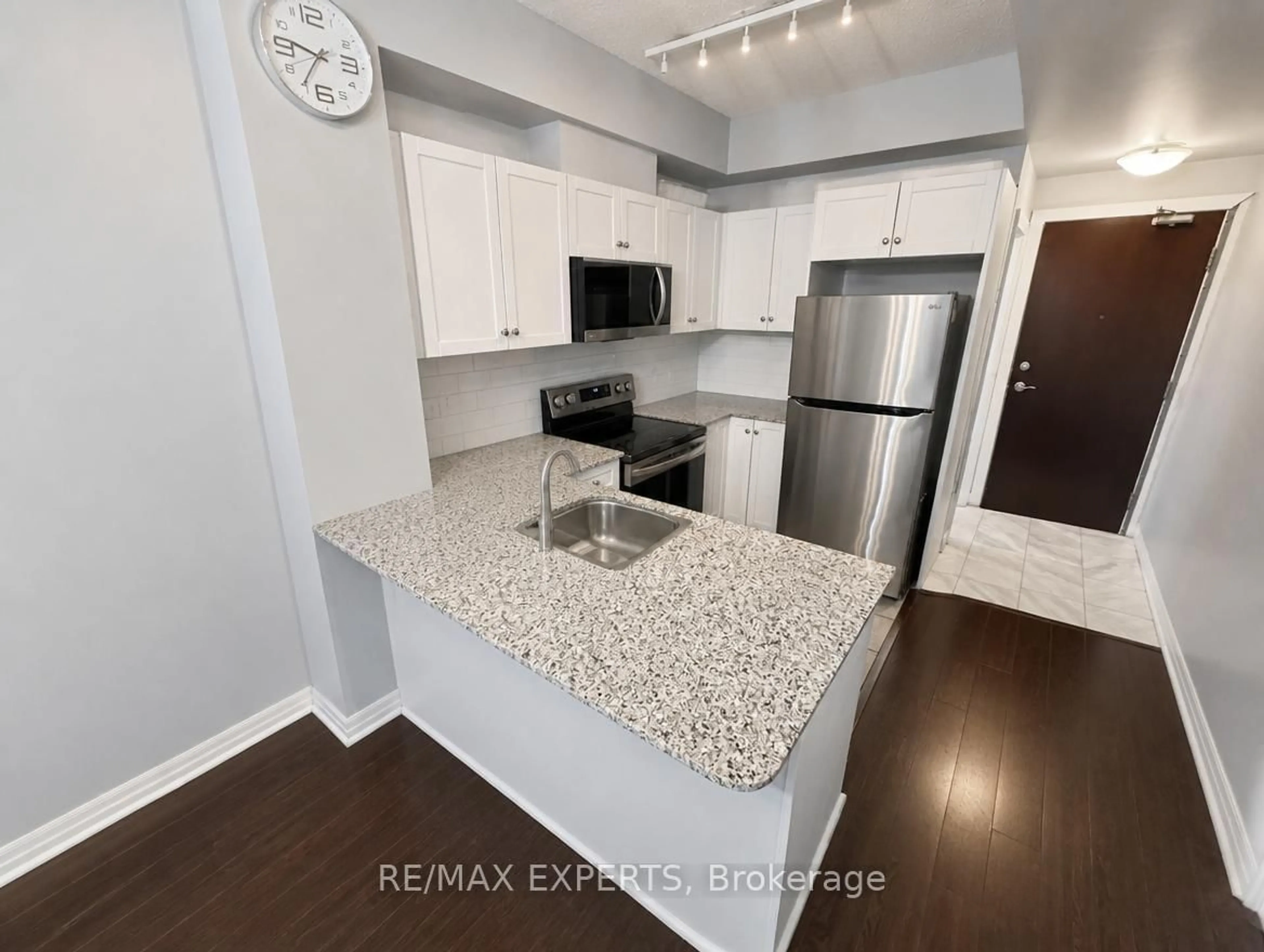 Open concept kitchen, wood/laminate floor for 1359 Rathburn Rd #209, Mississauga Ontario L4W 5P7