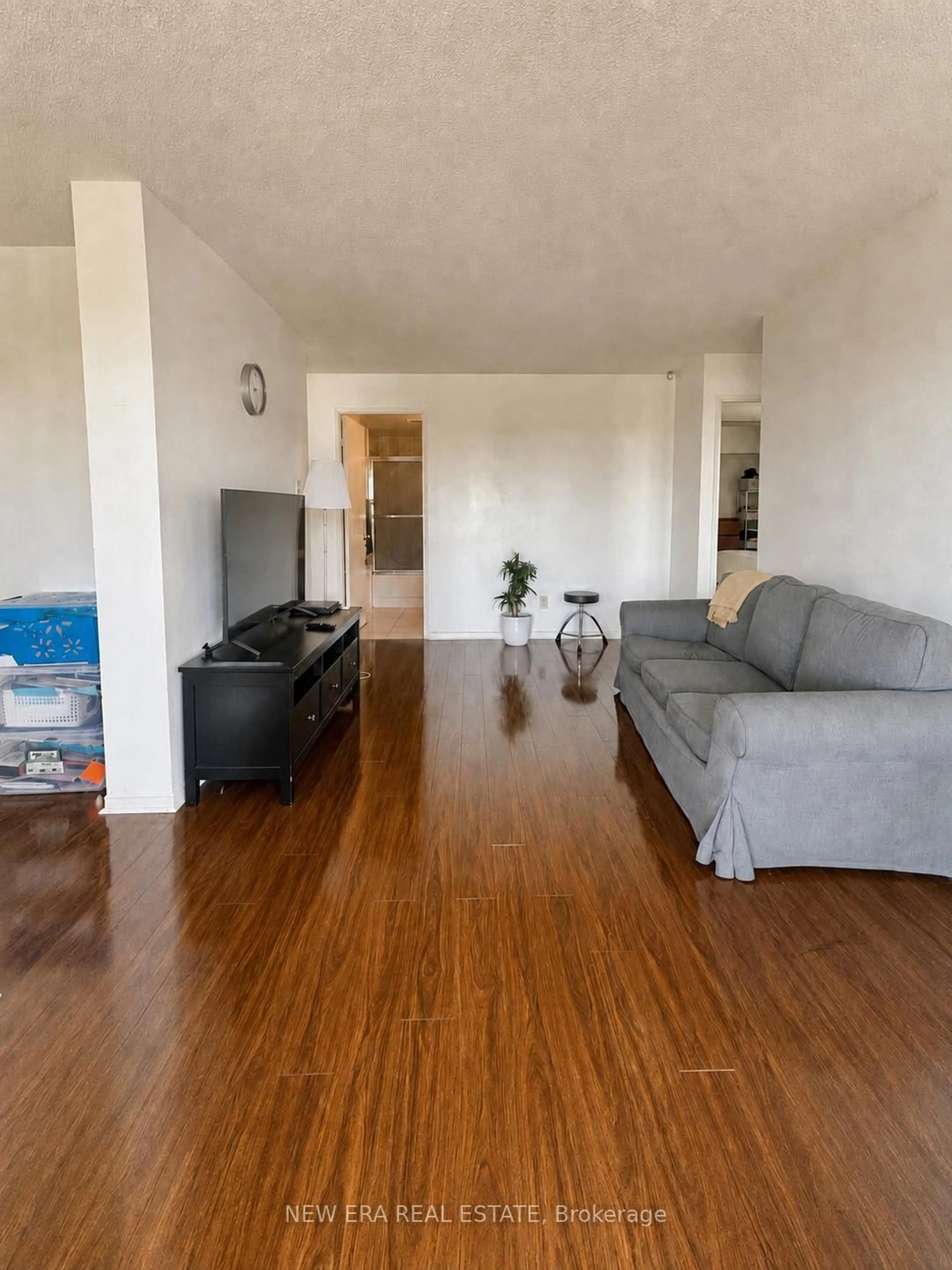 Living room with furniture, wood/laminate floor for 115 Hillcrest Ave #1912, Mississauga Ontario L5B 3Y9