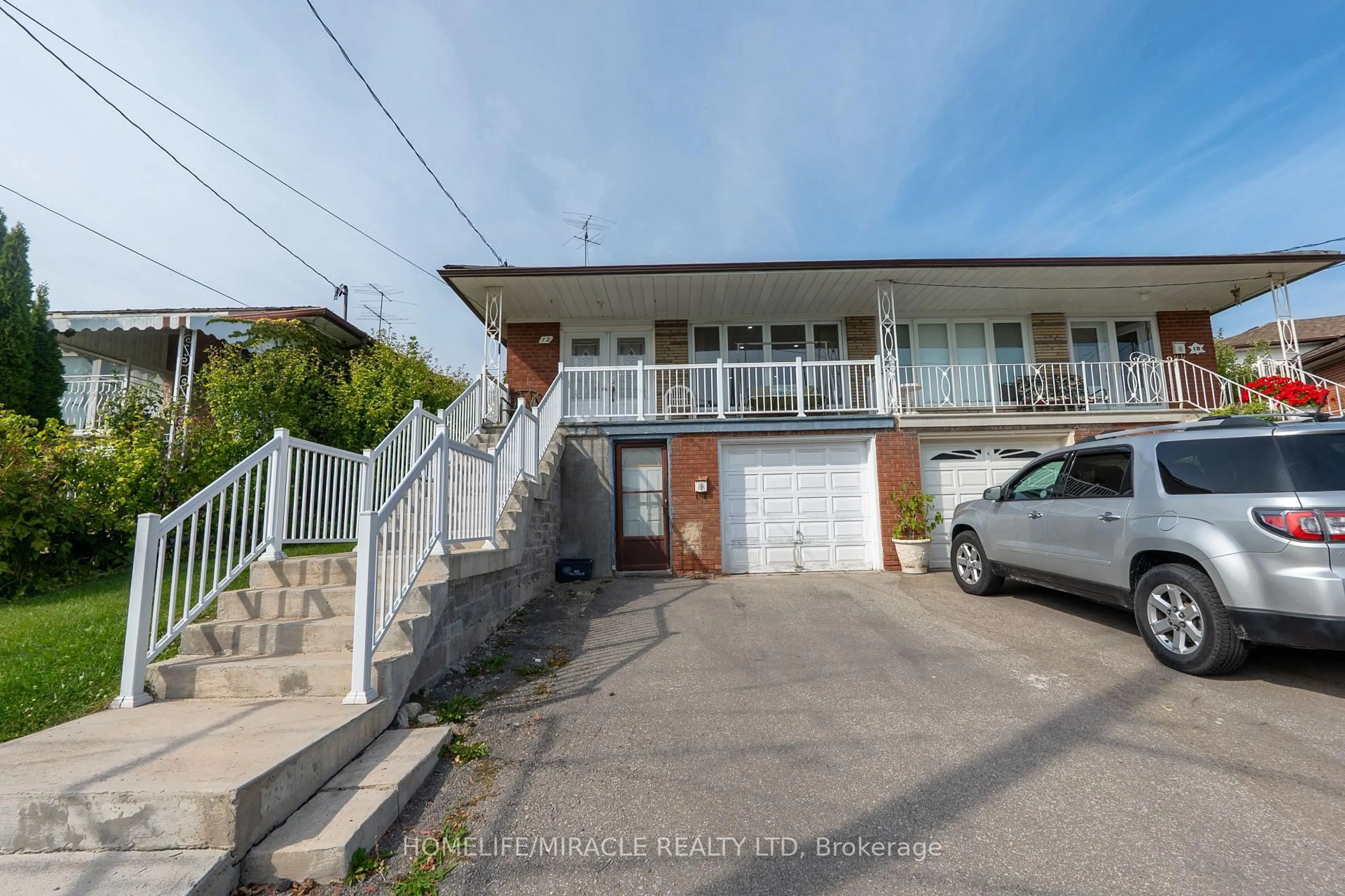 A pic from outside/outdoor area/front of a property/back of a property/a pic from drone, street for 12 Brubeck Rd, Toronto Ontario M9M 1W7