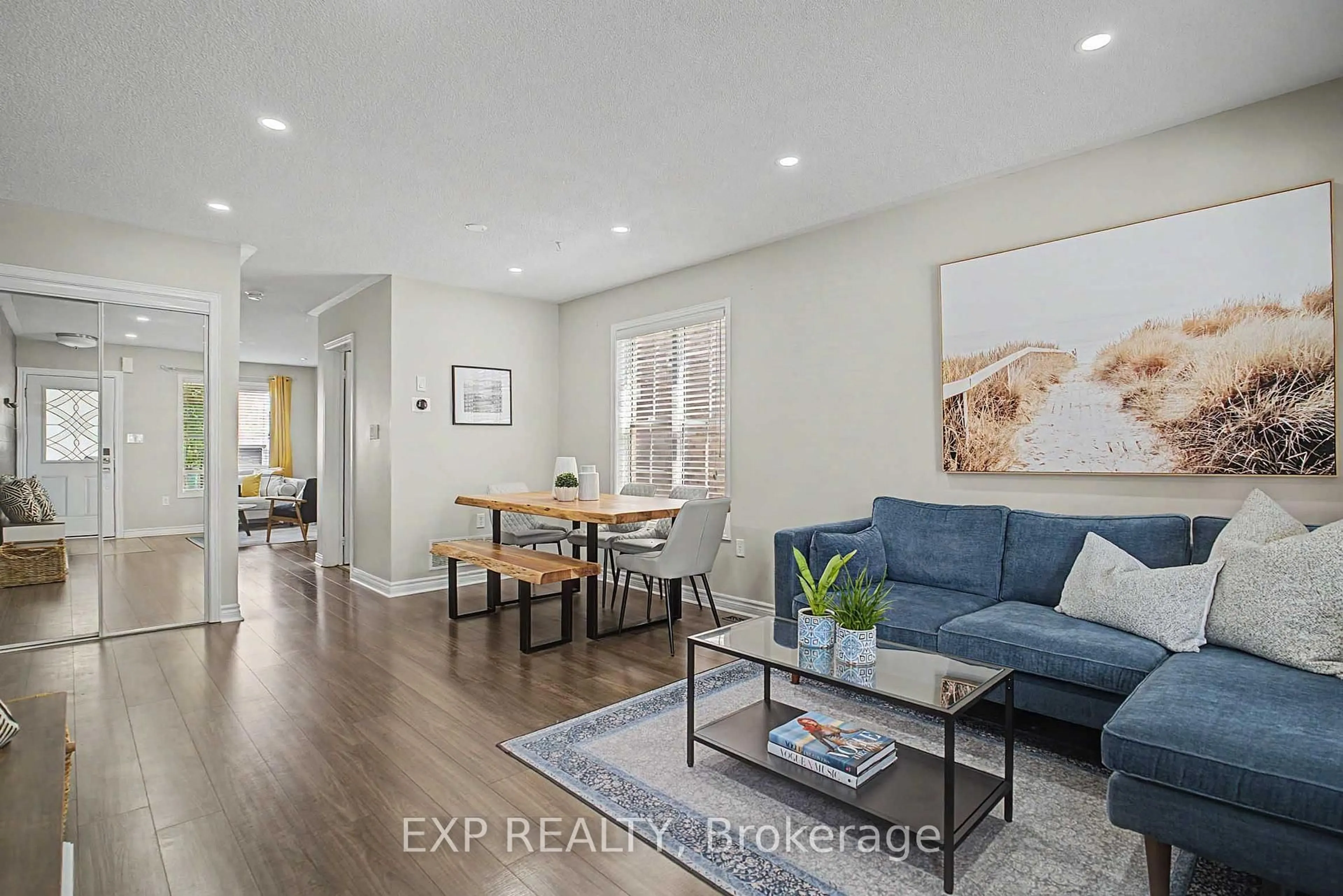 Living room with furniture, wood/laminate floor for 5421 Rochelle Way, Mississauga Ontario L5M 7Y2