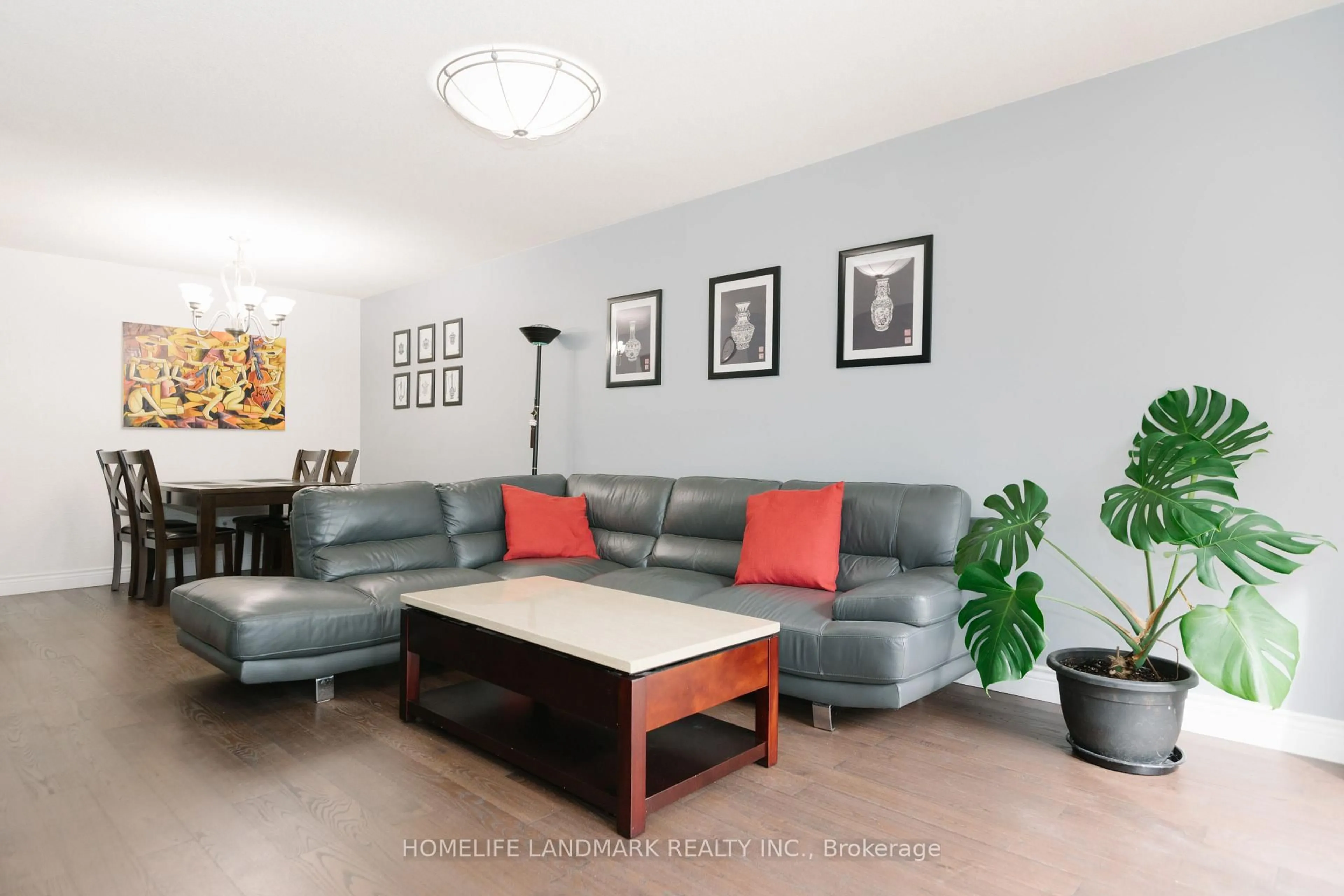 Living room with furniture, wood/laminate floor for 2419 Cashmere Ave, Mississauga Ontario L5B 2M7