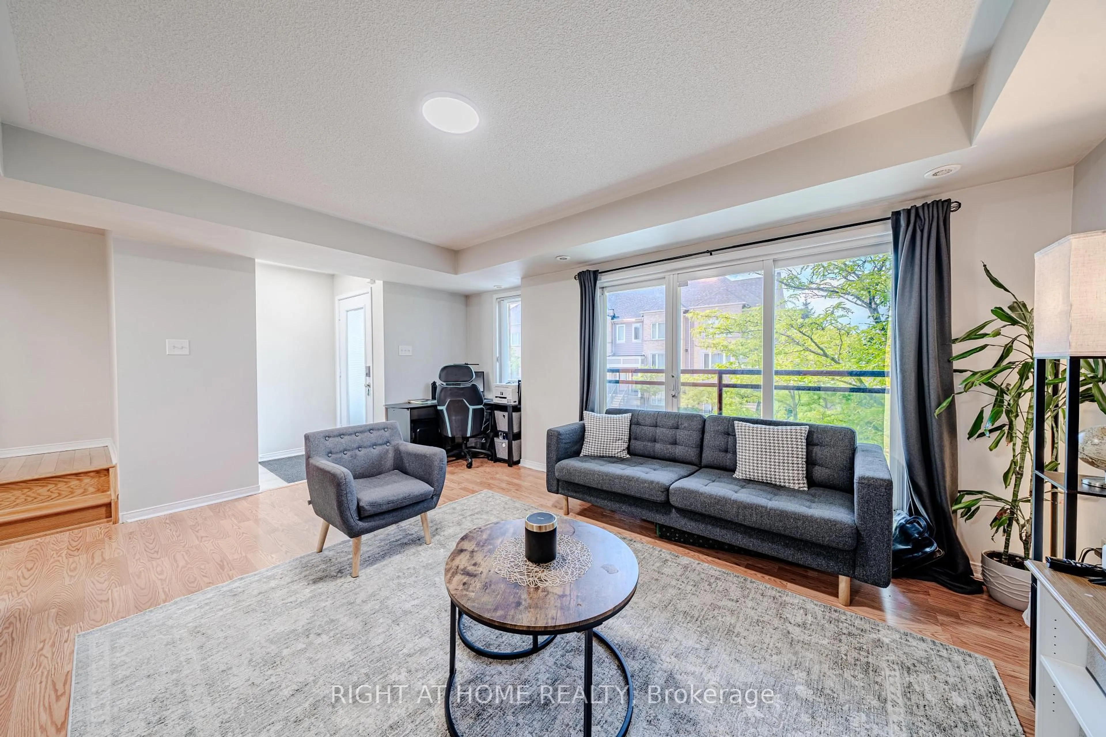 Living room with furniture, unknown for 5035 Oscar Peterson Blvd #100, Mississauga Ontario L5M 0P4