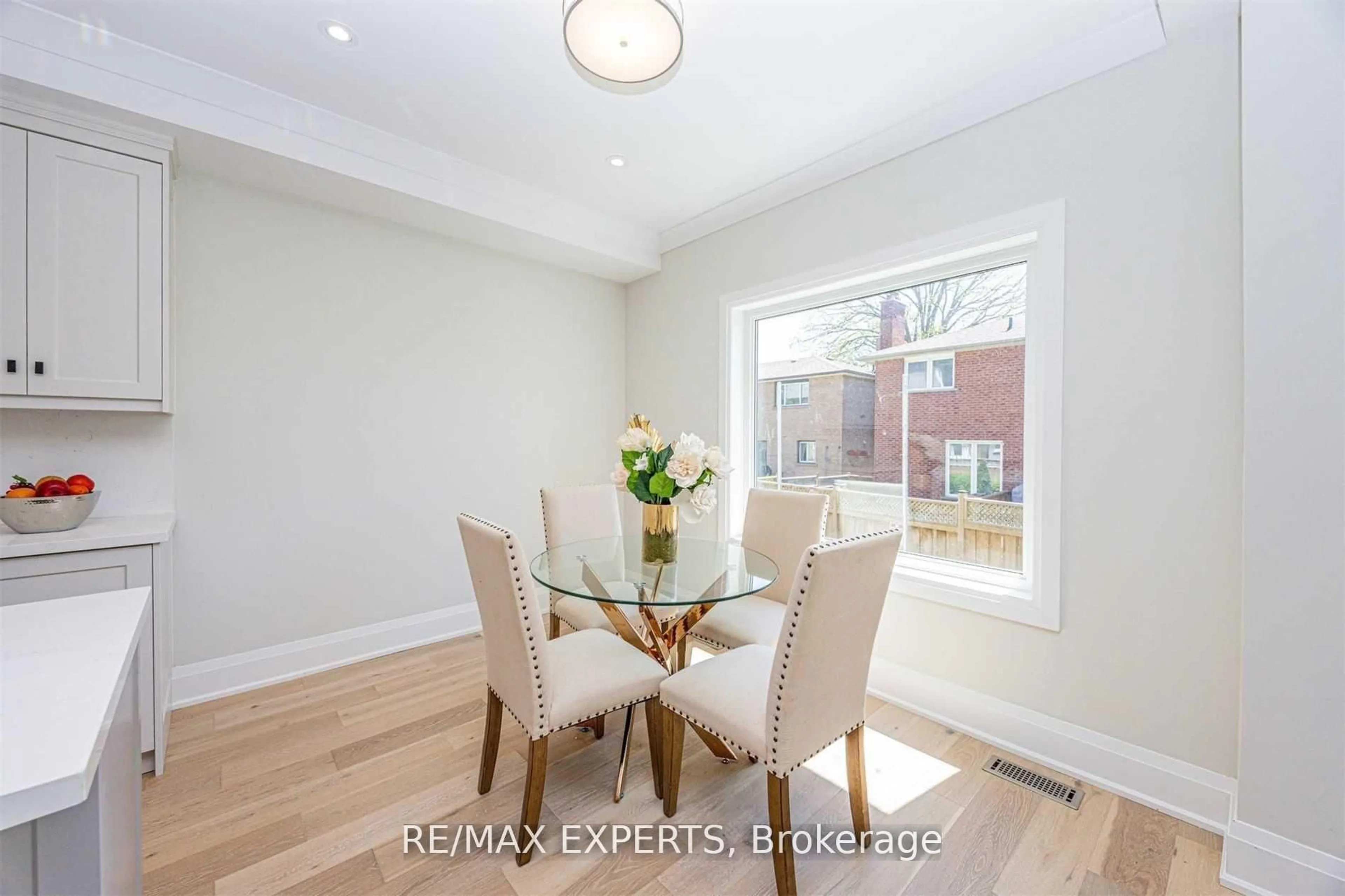 Dining room, wood/laminate floor for 55 Muir Ave, Toronto Ontario M9L 1H5
