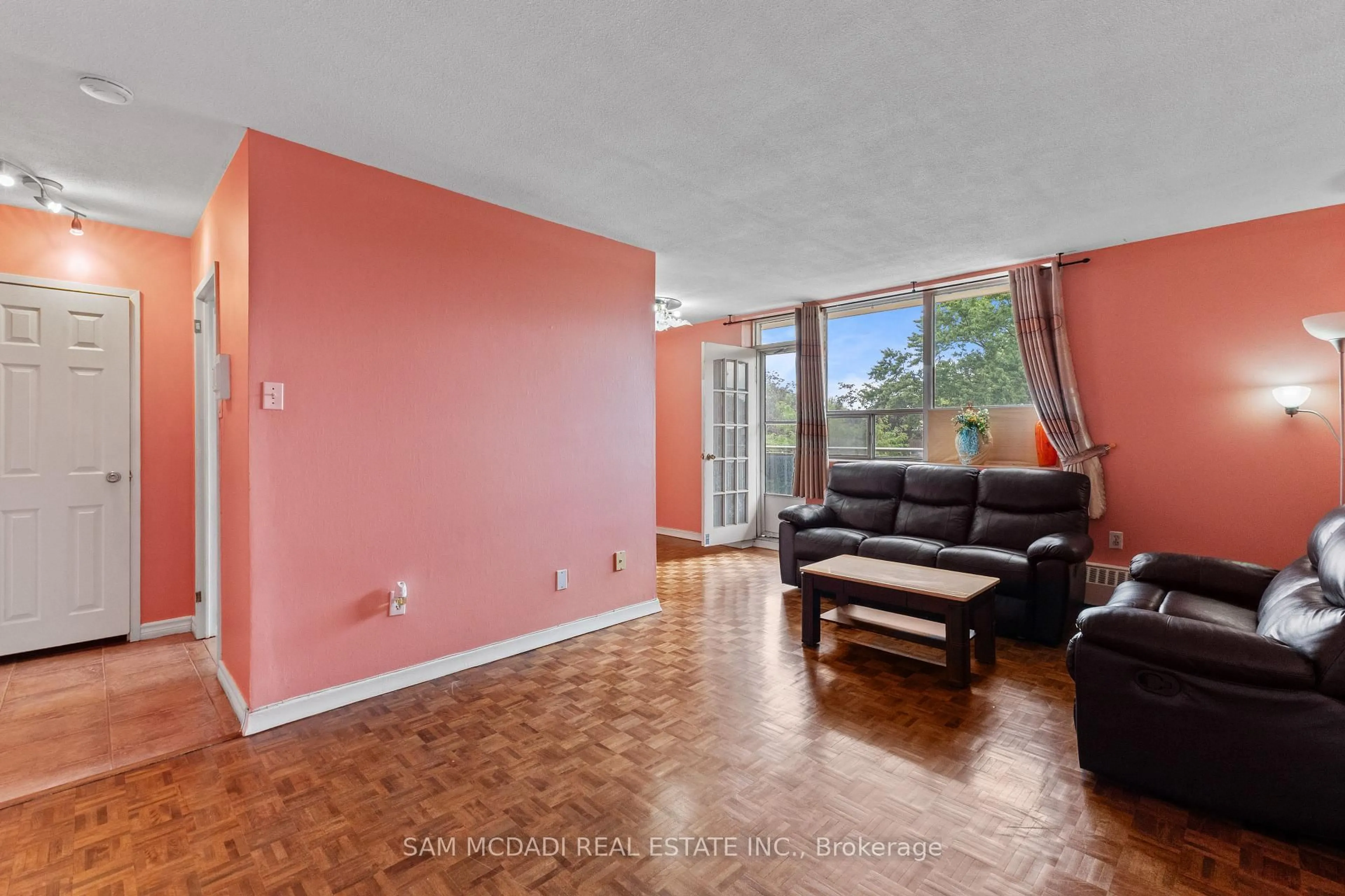 Living room with furniture, unknown for 3145 Queen Frederica Dr #208, Mississauga Ontario L4Y 3A7