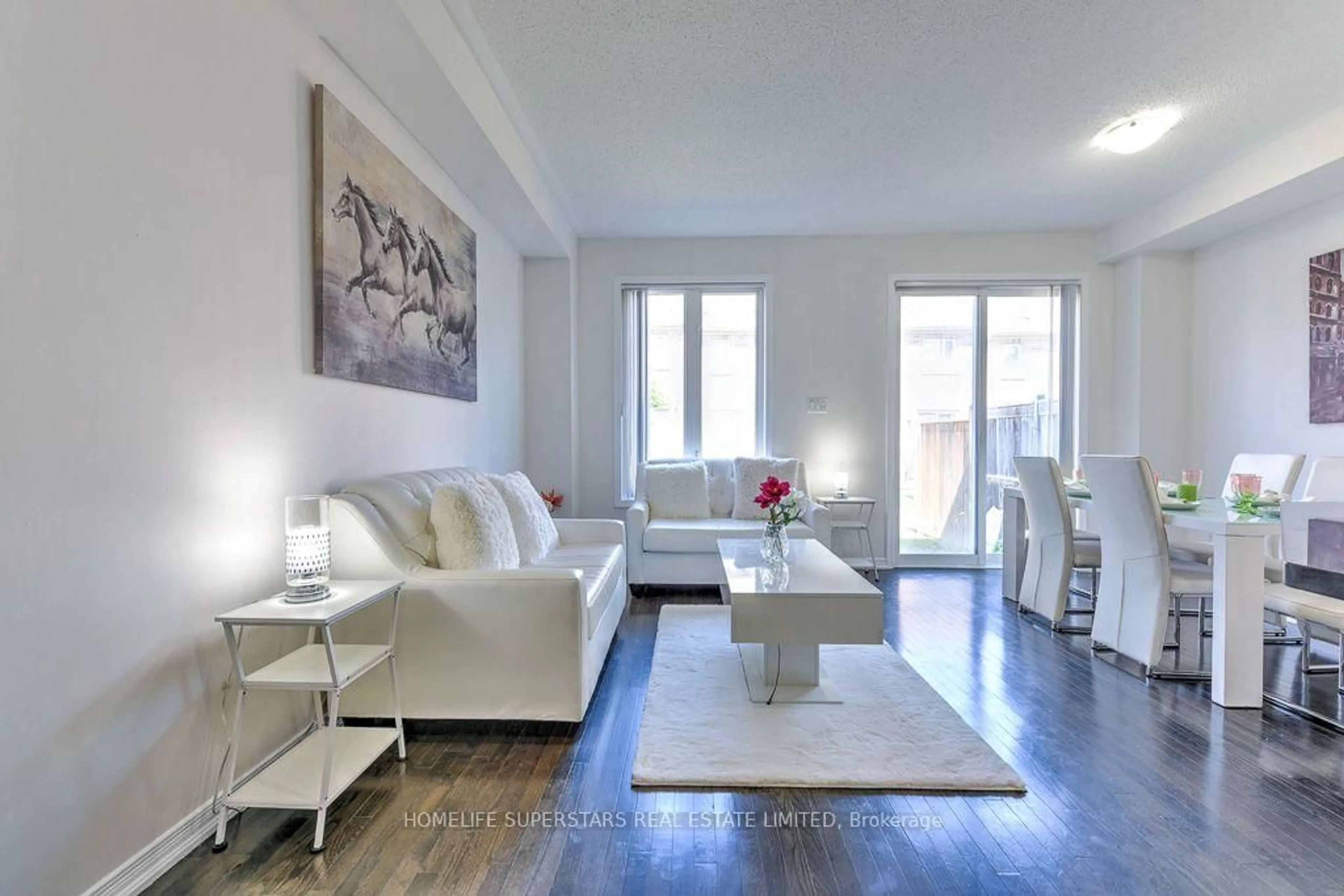 Living room with furniture, wood/laminate floor for 61 Utopia Way, Brampton Ontario L6P 4A4
