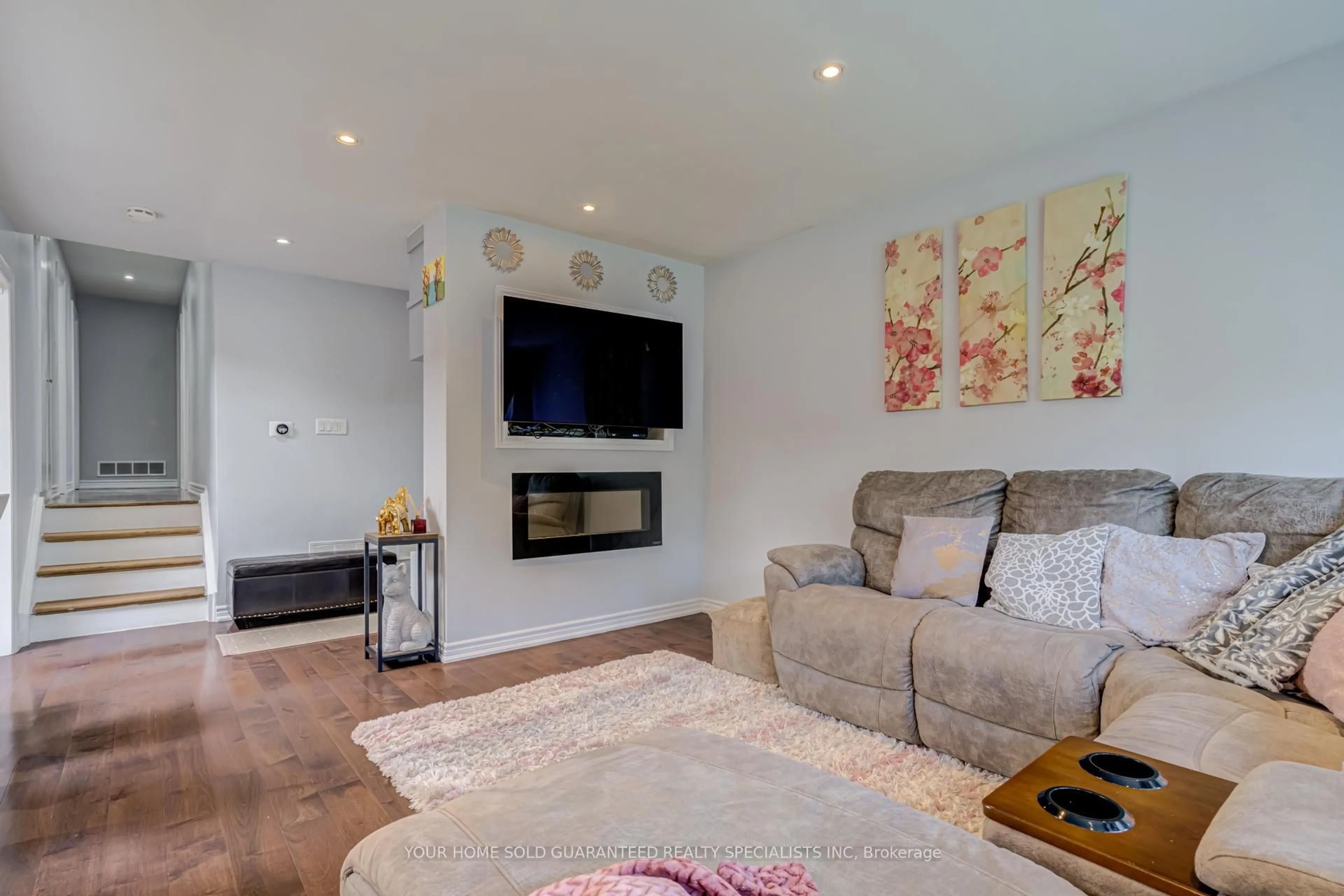 Living room with furniture, wood/laminate floor for 5 Hallow Cres, Toronto Ontario M9W 2V8