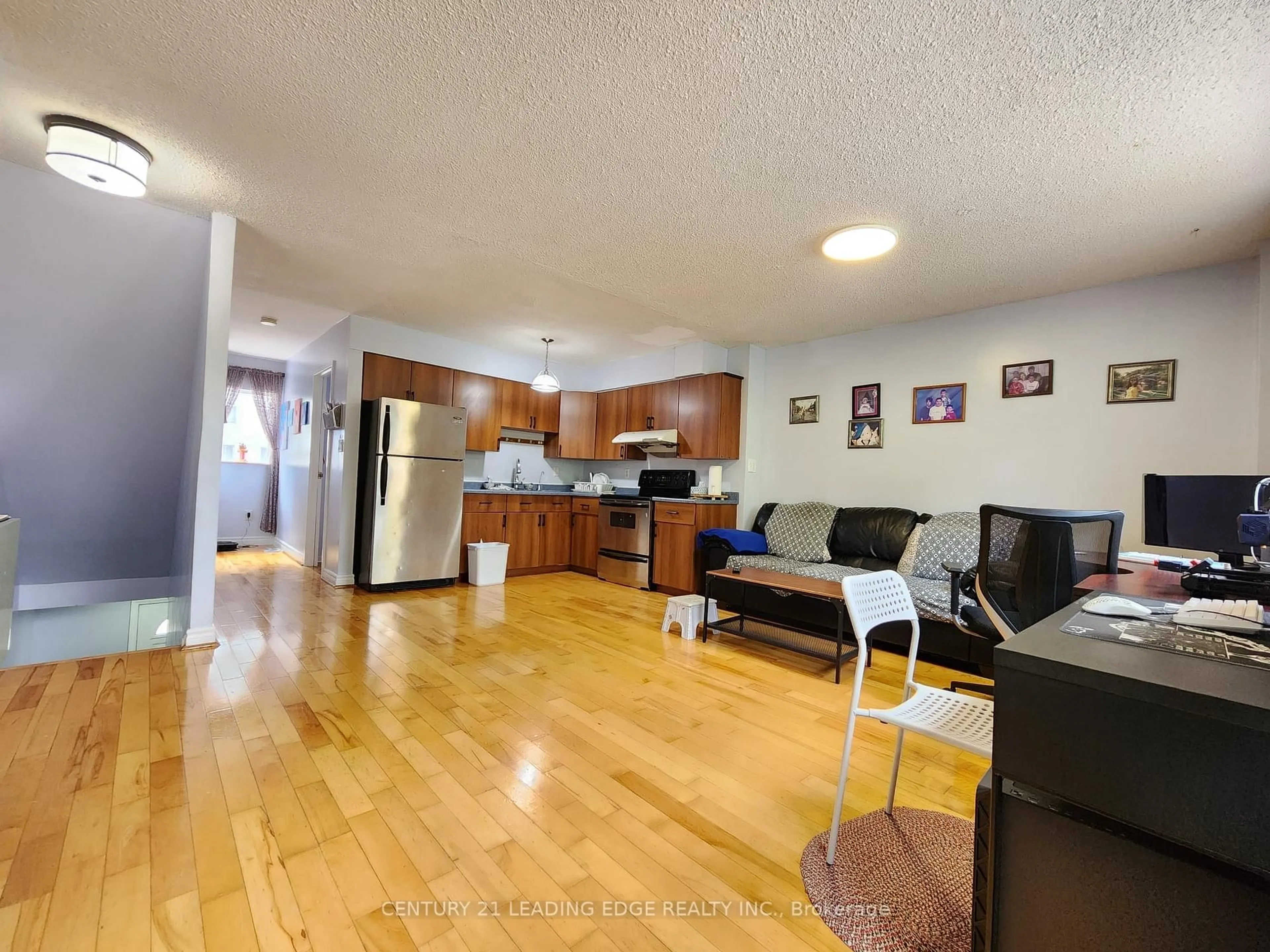Living room with furniture, wood/laminate floor for 203 Lotherton Ptwy #82, Toronto Ontario M6B 2G6