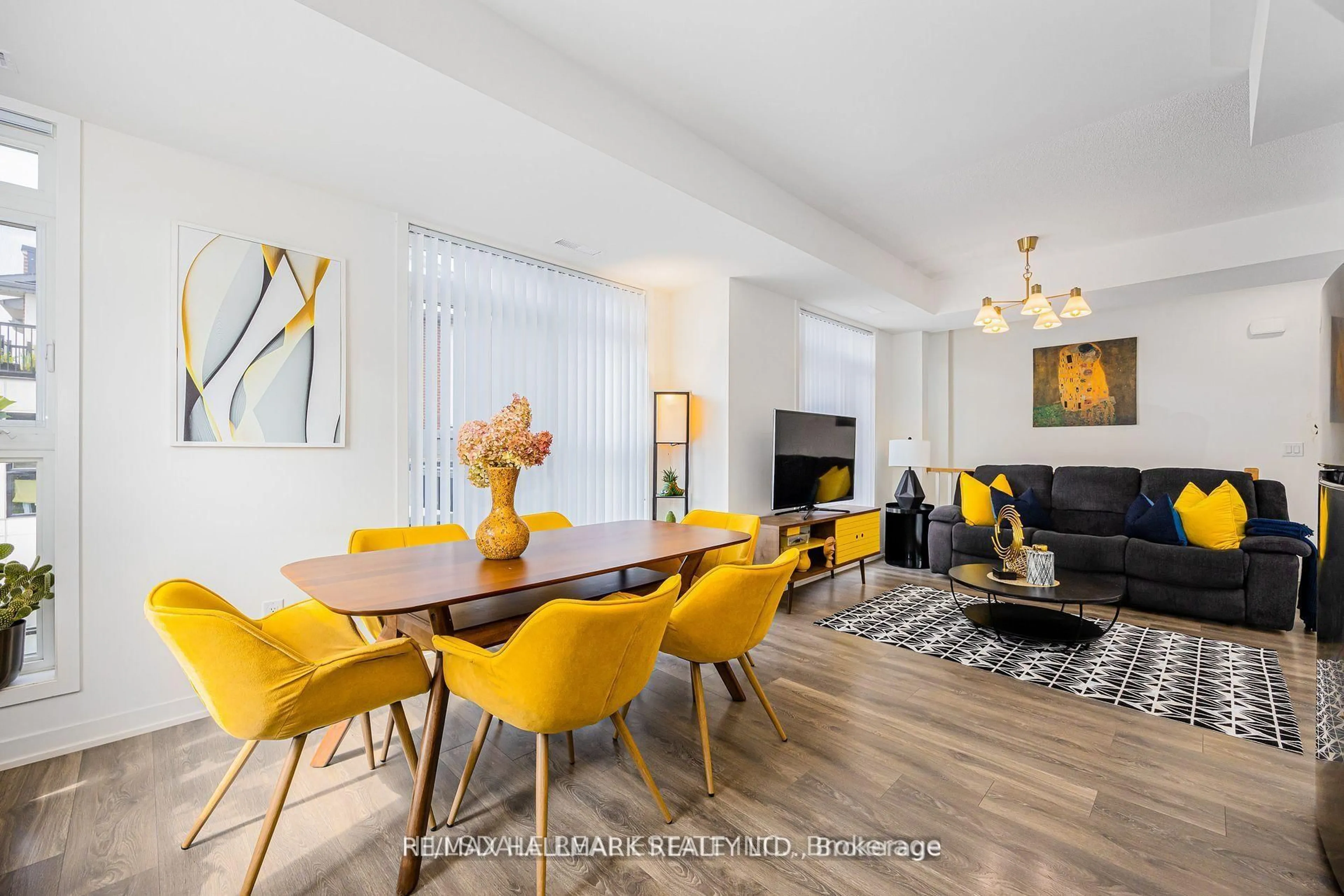 Living room with furniture, wood/laminate floor for 90 Canon Jackson Dr #207, Toronto Ontario M6M 0C1