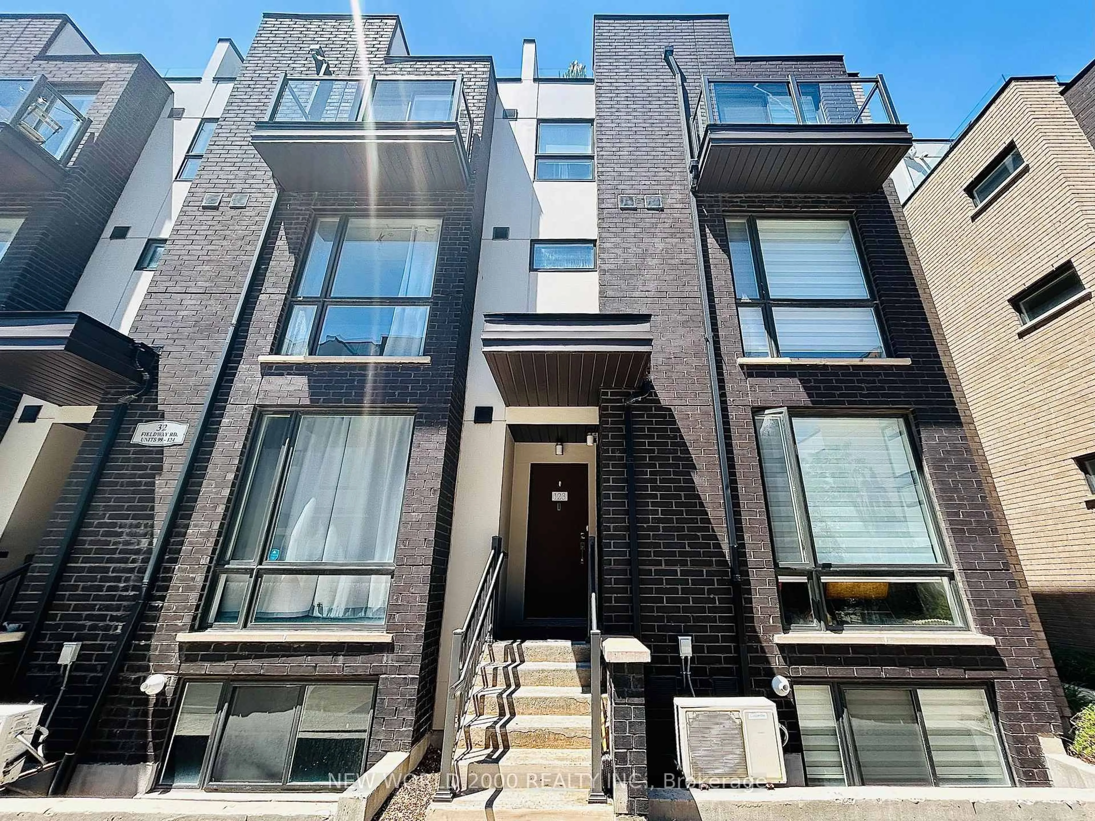 Home with brick exterior material, street for 32 Fieldway Rd #123, Toronto Ontario M8Z 0E3