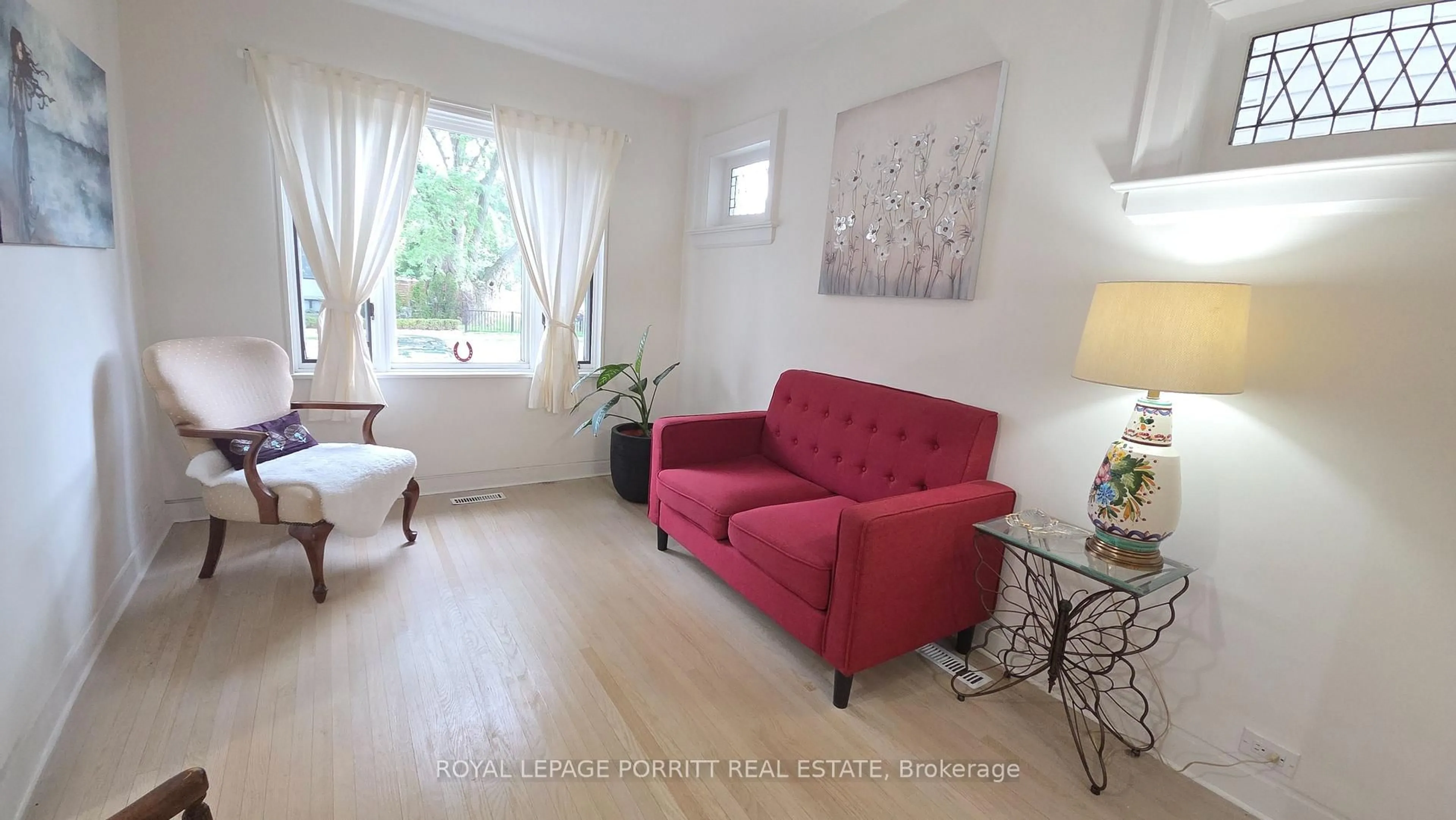 Living room with furniture, wood/laminate floor for 51 Thirty Sixth St, Toronto Ontario M8W 3L1