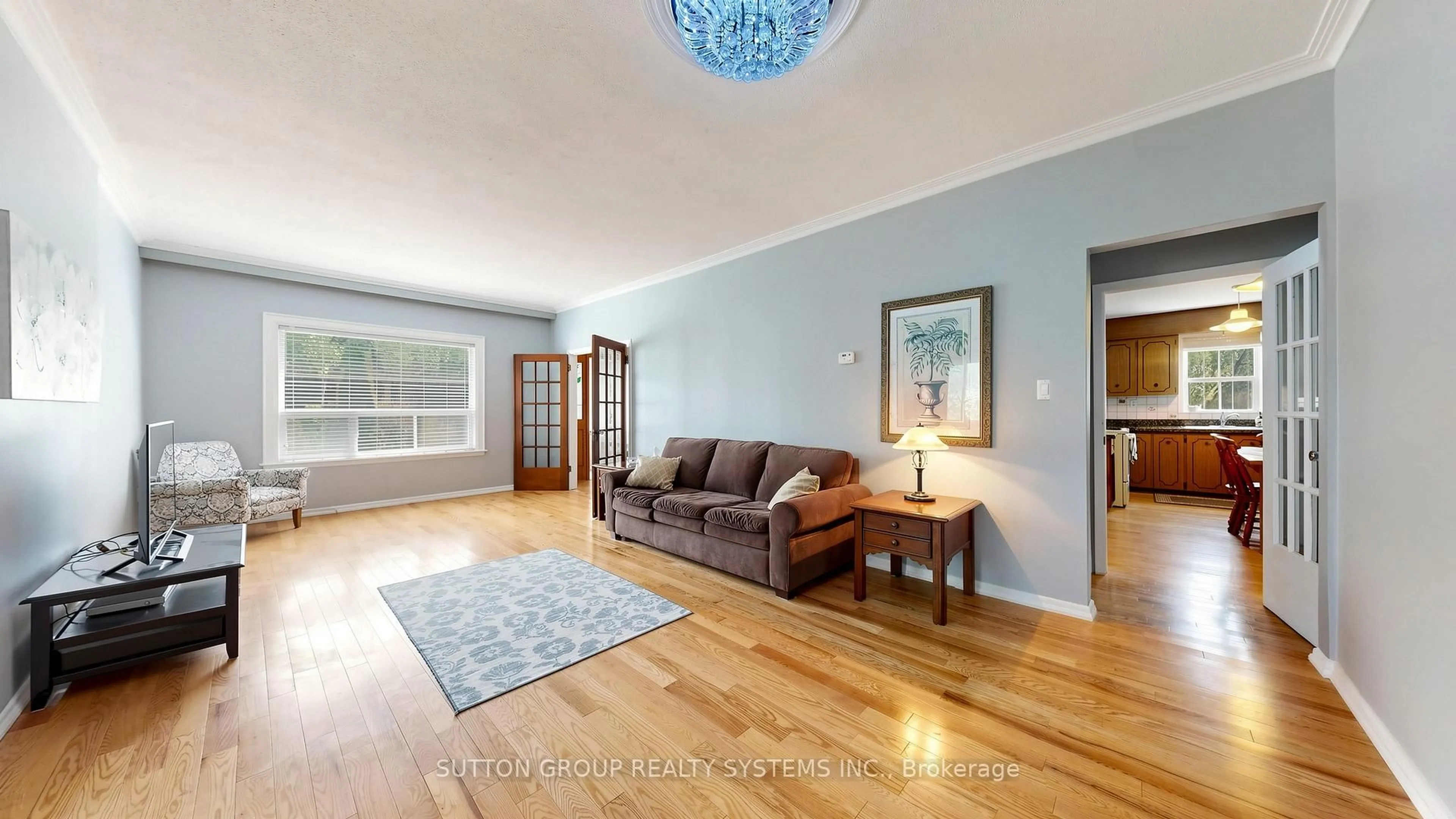Living room with furniture, wood/laminate floor for 114 Rosemount Ave, Toronto Ontario M6H 2M7