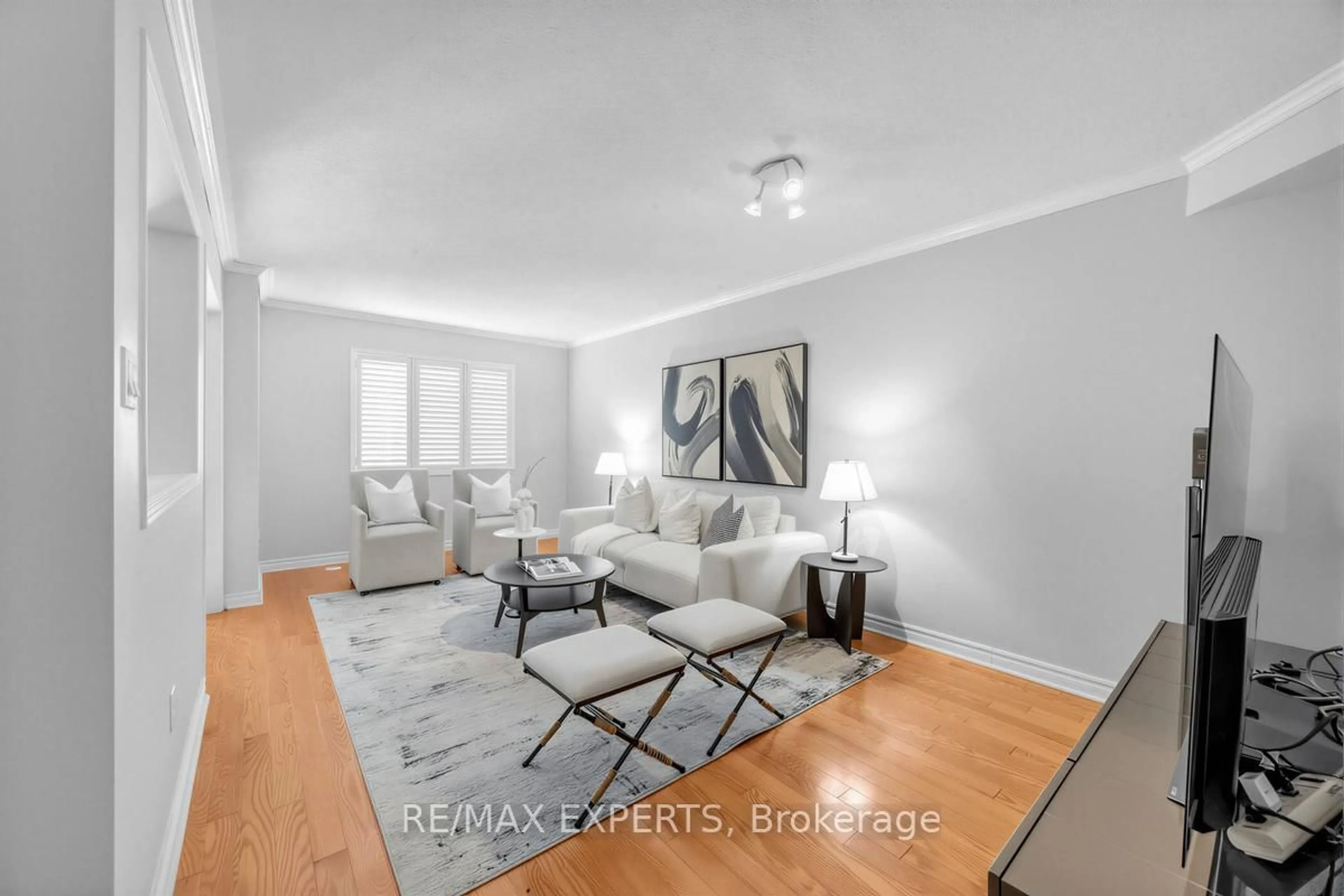 Living room with furniture, wood/laminate floor for 601 Shoreline Dr #97, Mississauga Ontario L5B 4K8