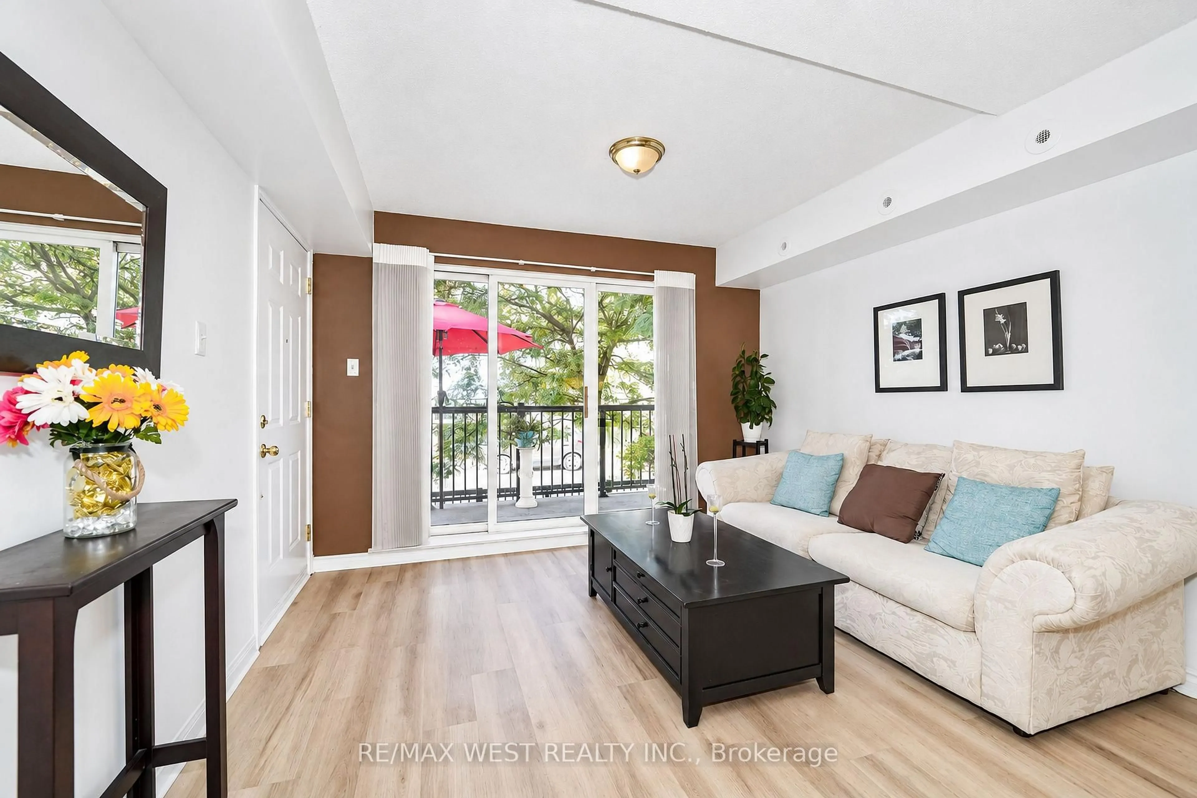 Living room with furniture, wood/laminate floor for 65 George Appleton Way #2066, Toronto Ontario M3M 0A2