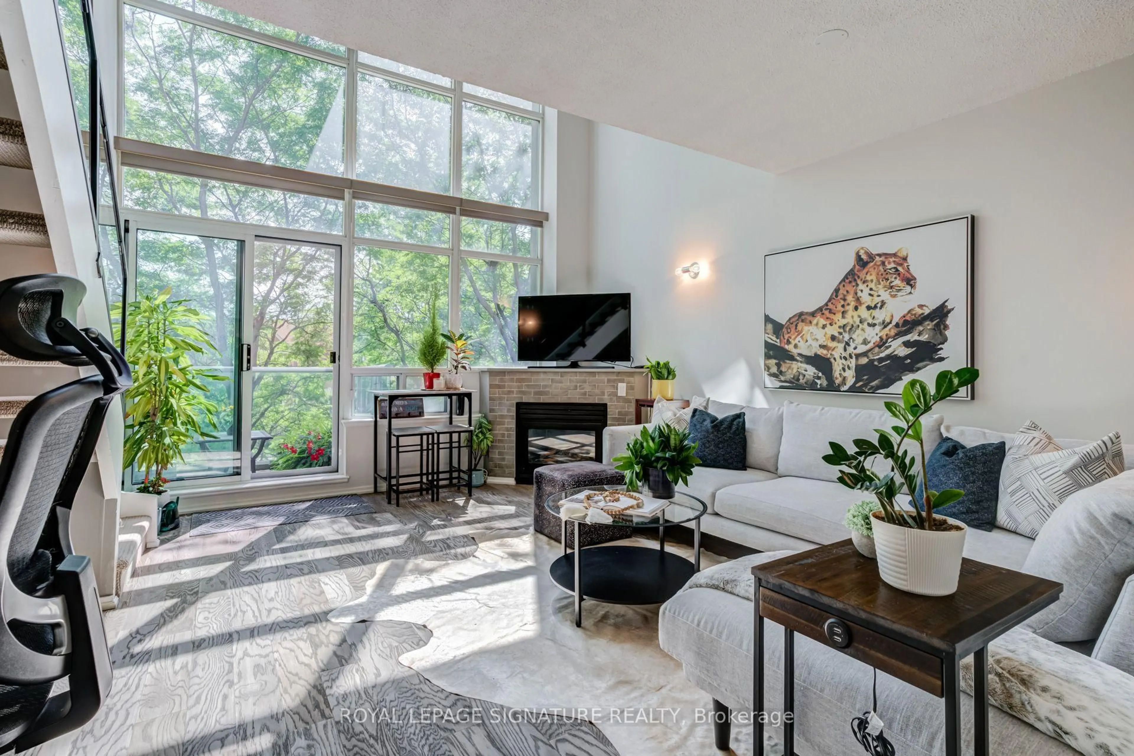 Living room with furniture, ceramic/tile floor for 200 Manitoba St #203, Toronto Ontario M8Y 3Y9