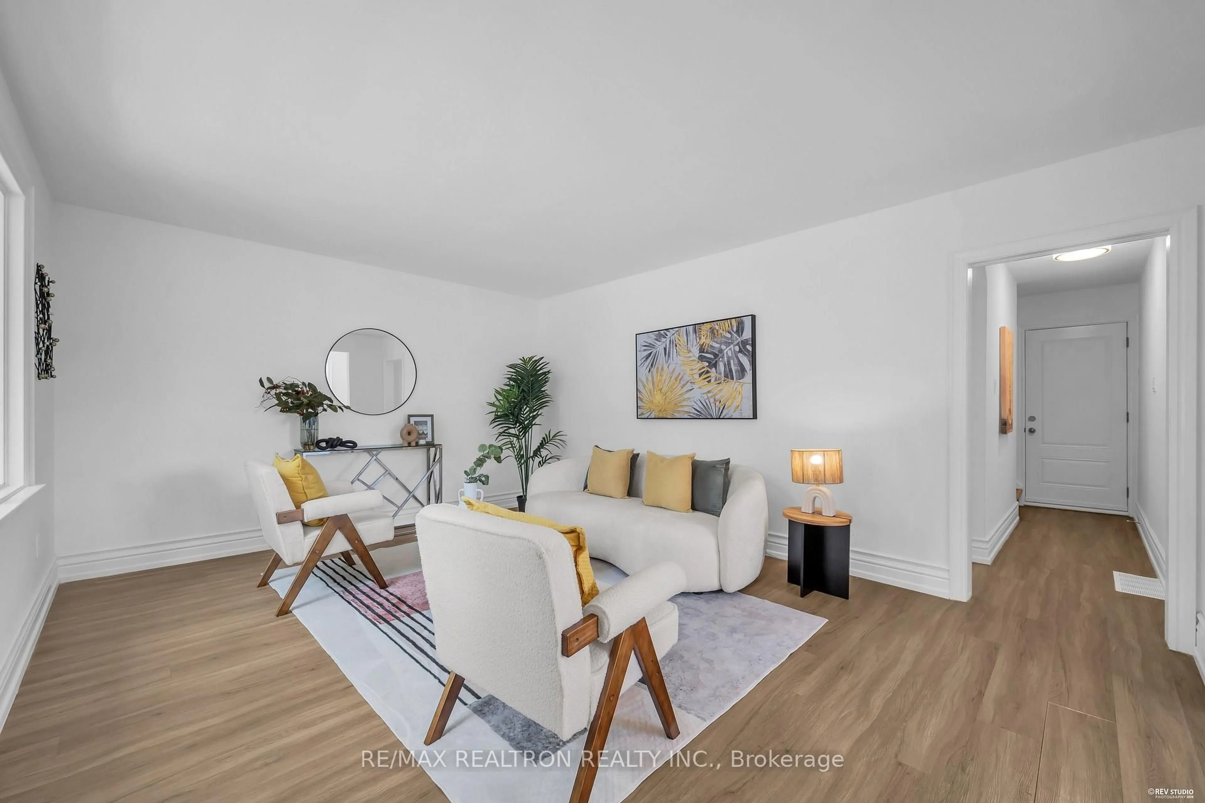 Living room with furniture, wood/laminate floor for 11 Harrow Dr, Toronto Ontario M6M 2X2
