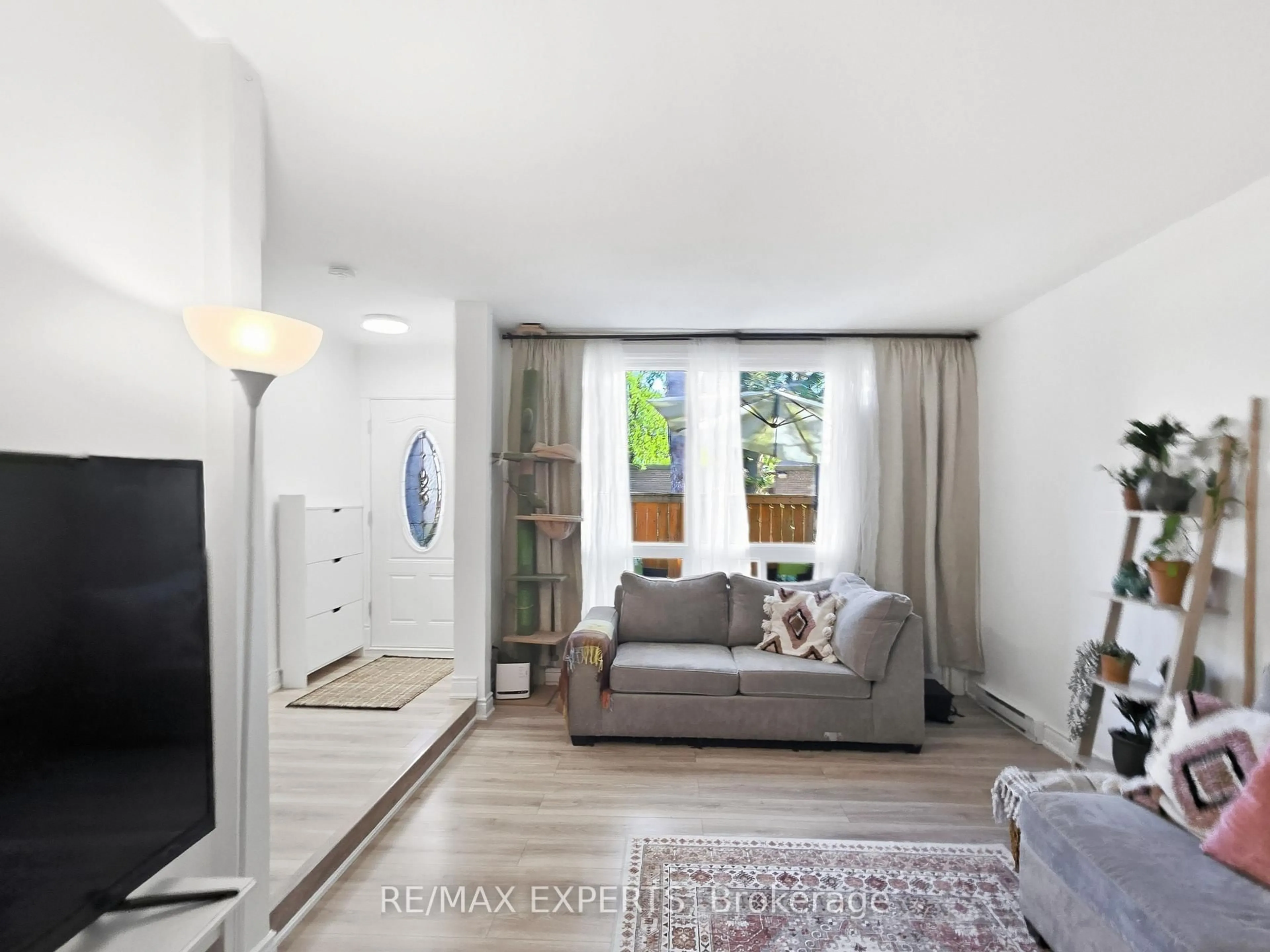 Living room with furniture, wood/laminate floor for 30 Tandridge Cres #853, Toronto Ontario M9W 2P2