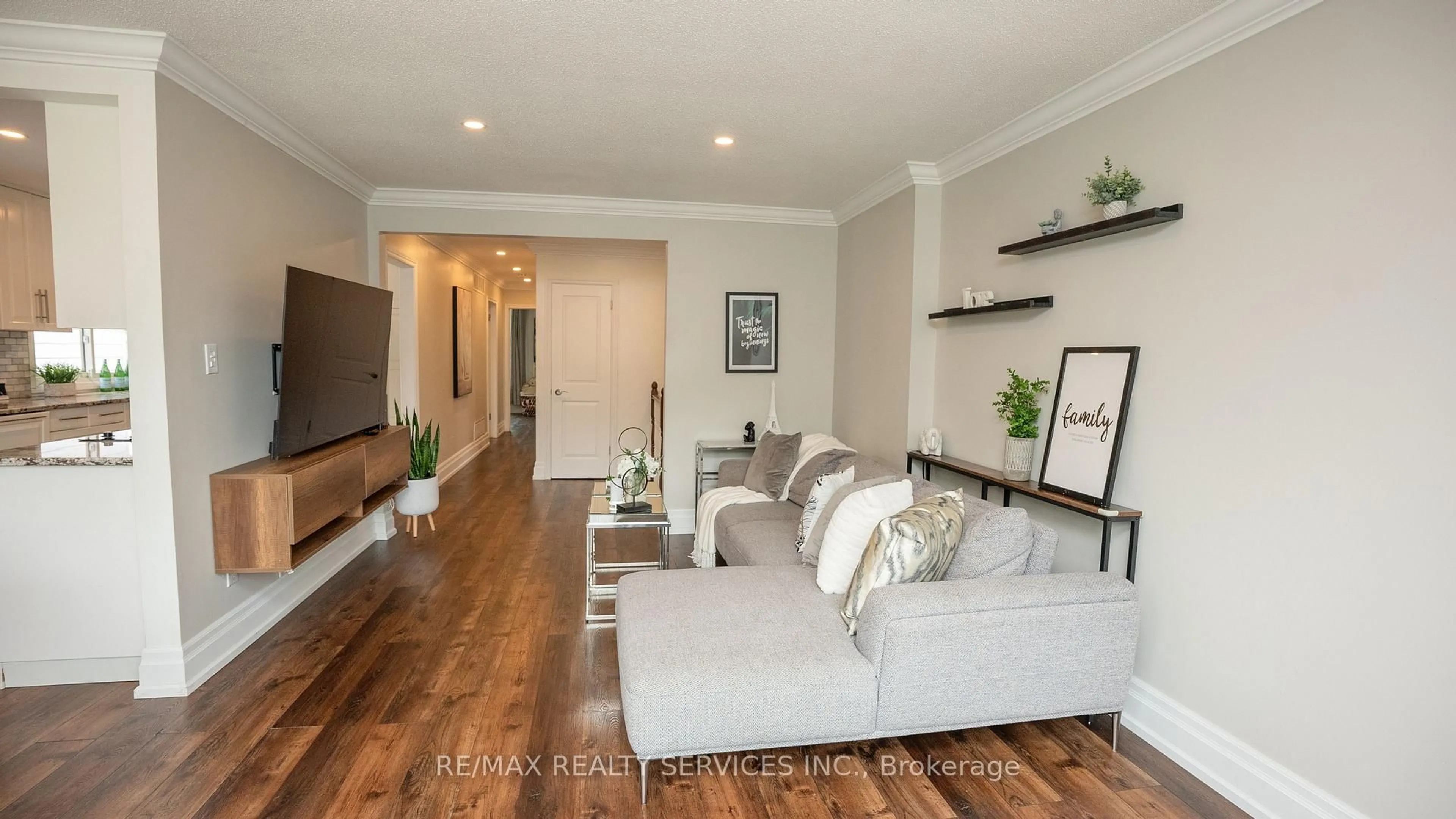 Living room with furniture, wood/laminate floor for 3469 Caplan Cres, Burlington Ontario L7N 2P9