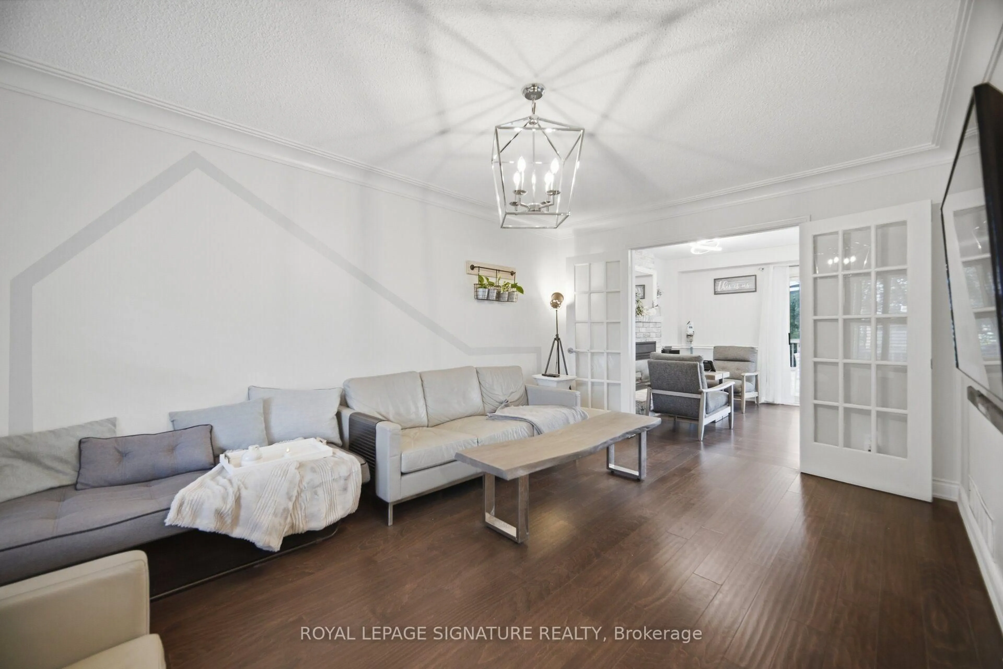Living room with furniture, wood/laminate floor for 3217 Hazelwood Ave, Burlington Ontario L7M 2V3