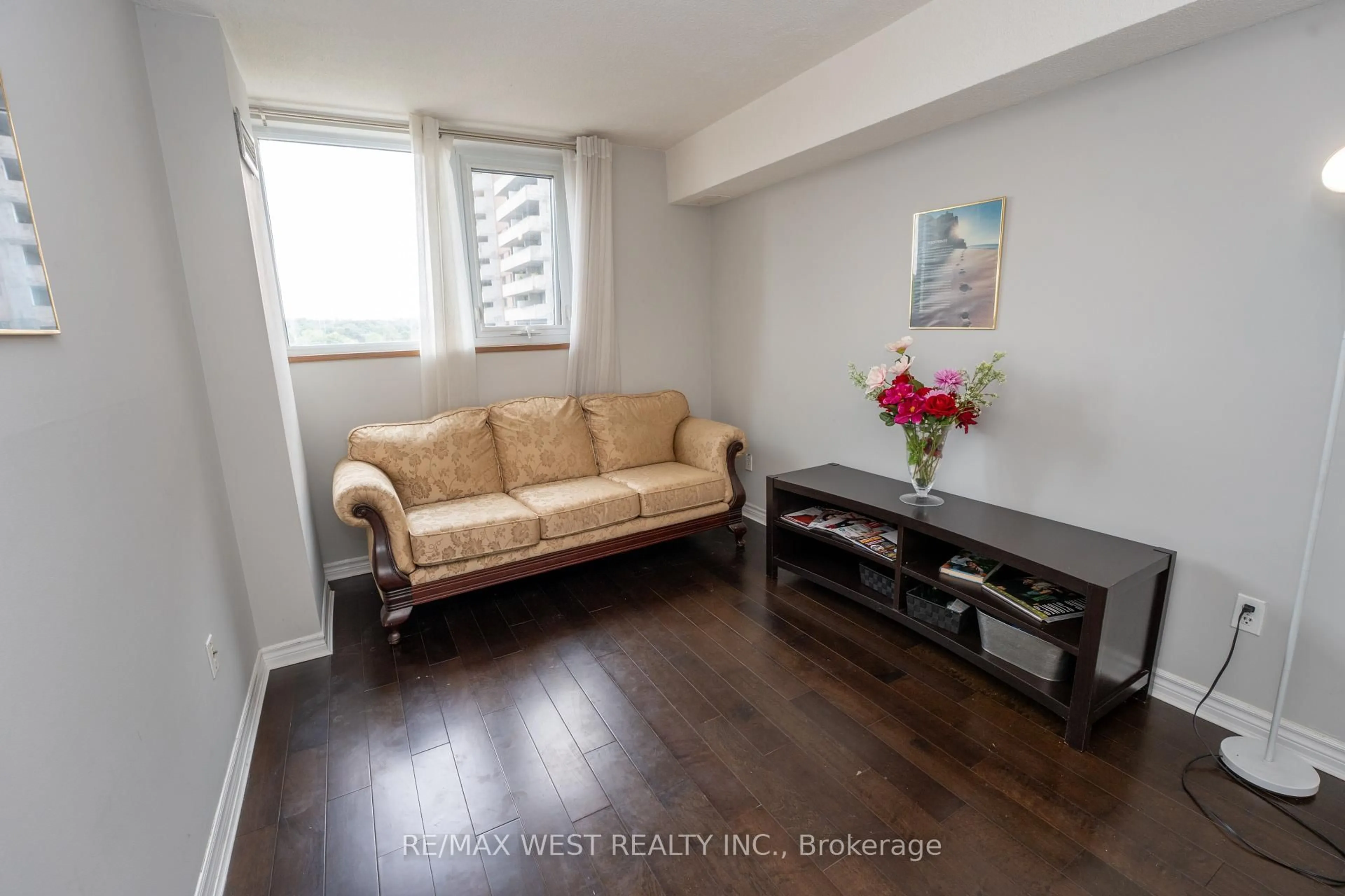 Living room with furniture, wood/laminate floor for 260 Scarlett Rd #709, Toronto Ontario M6N 4X6