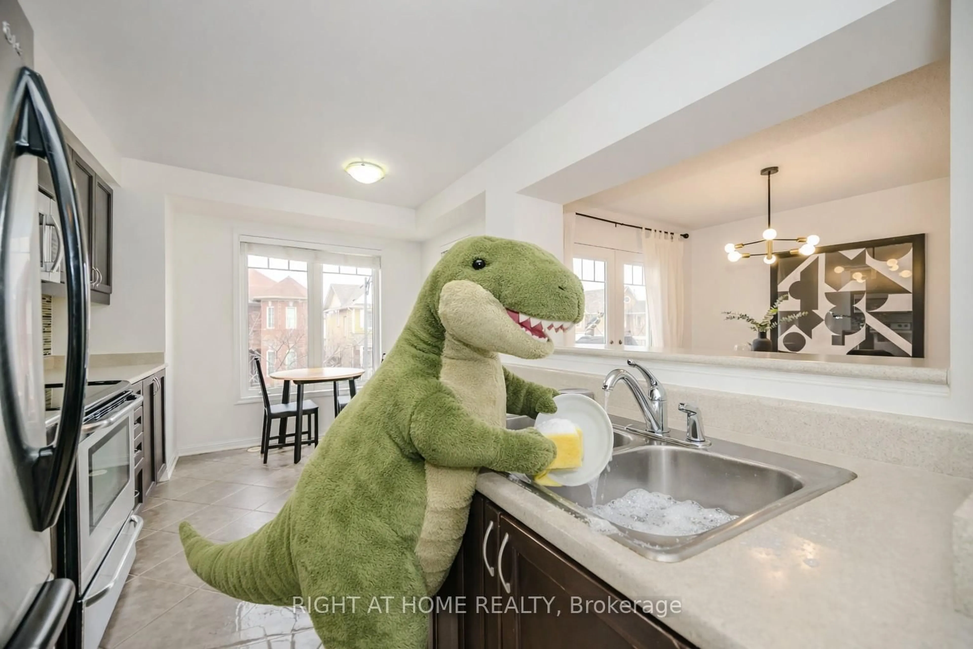Open concept kitchen, ceramic/tile floor for 525 Cavanagh Lane, Milton Ontario L9T 8G4