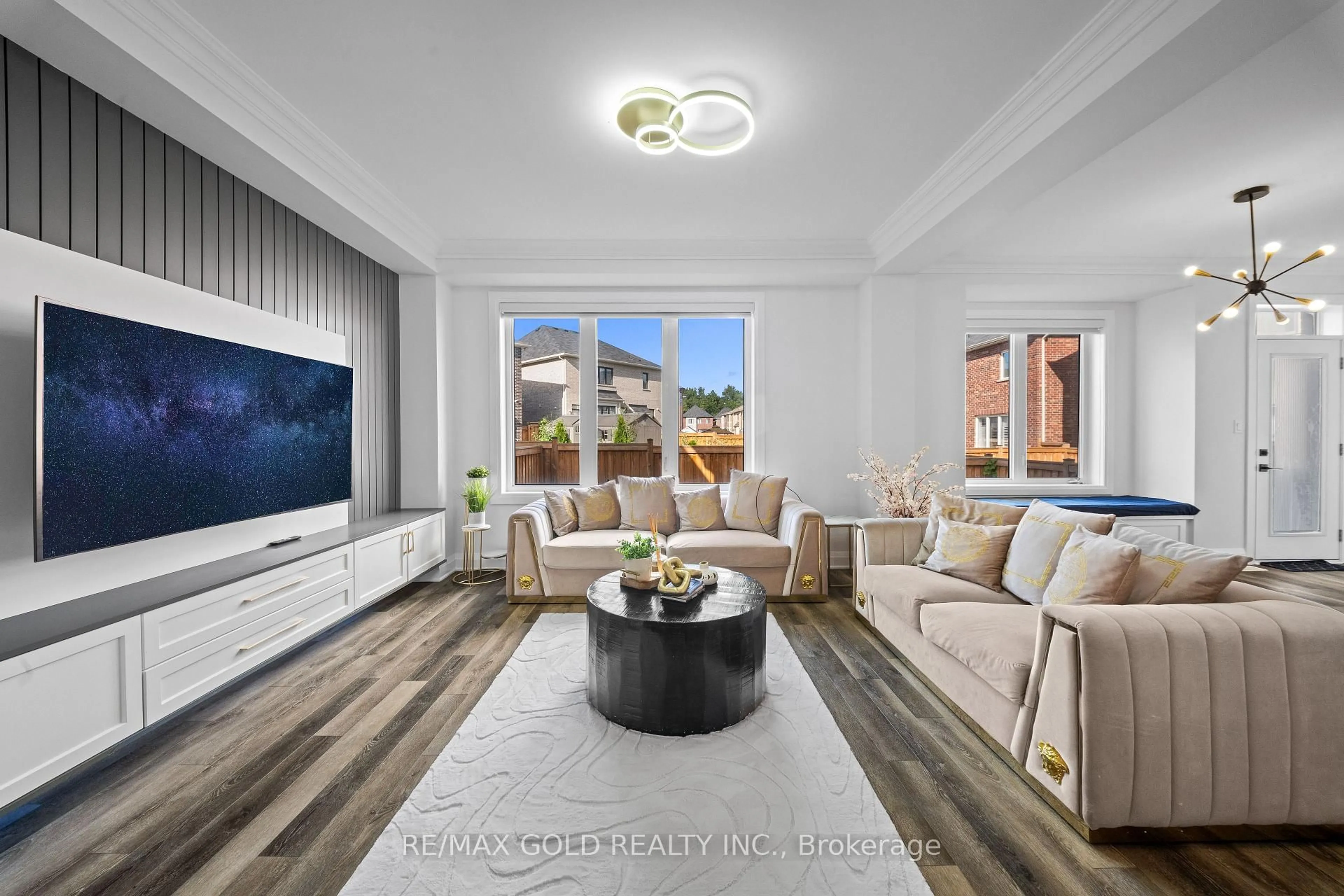 Living room with furniture, wood/laminate floor for 15 Speckled Alder St, Caledon Ontario L7C 4J1