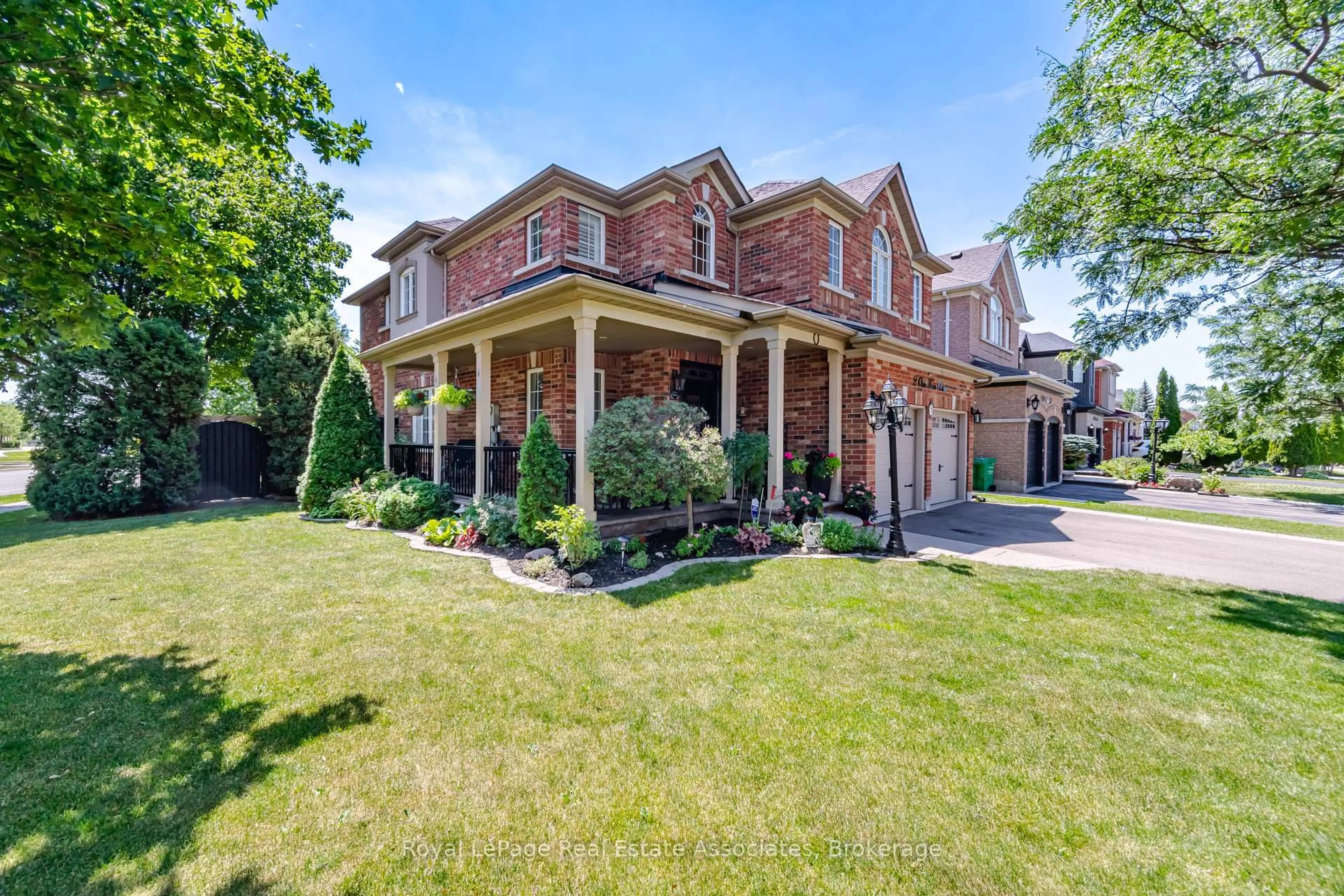 Home with brick exterior material, street for 2 Olde Town Rd, Brampton Ontario L6X 4V3