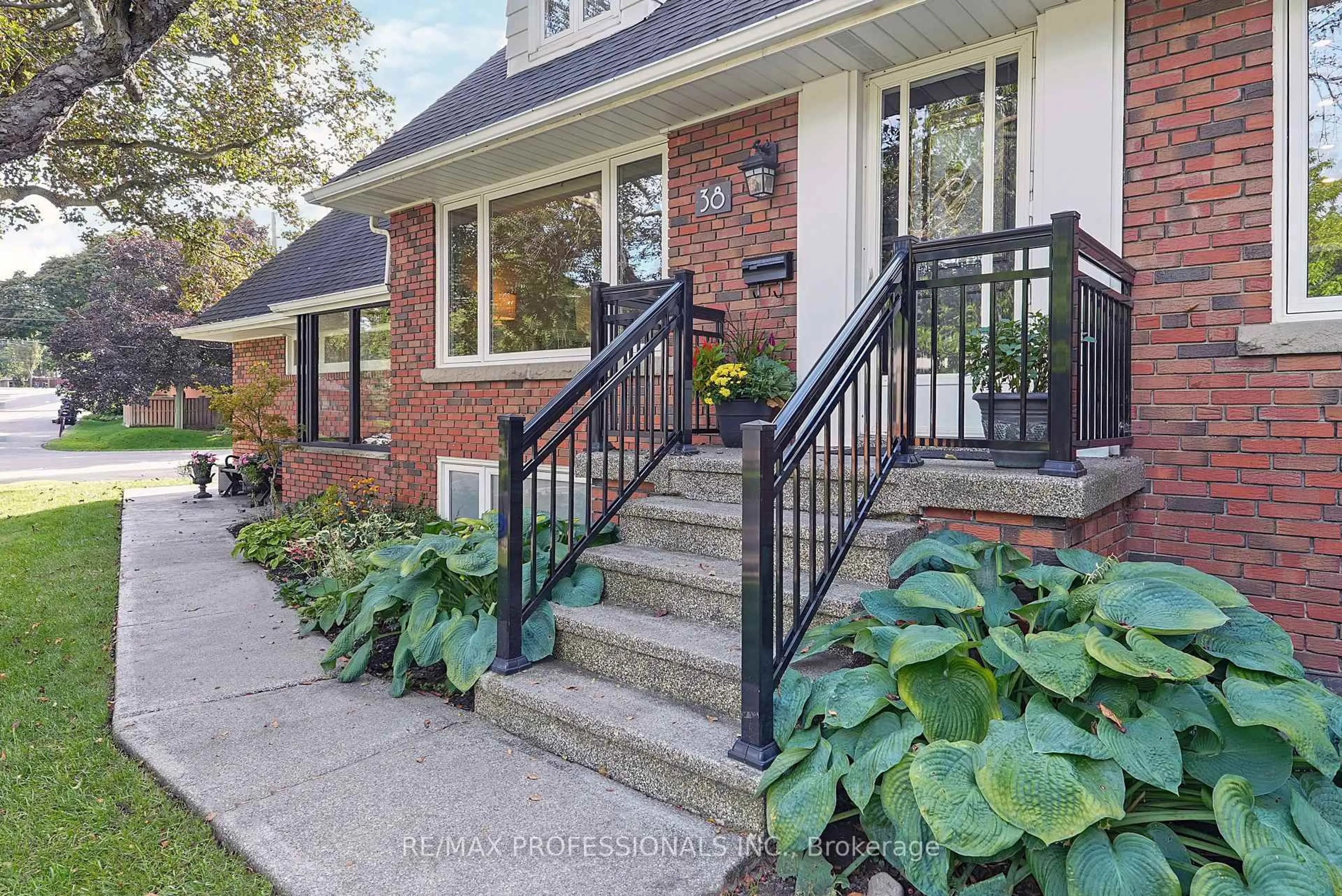 Home with brick exterior material, street for 38 Ballacaine Dr, Toronto Ontario M8Y 4A9