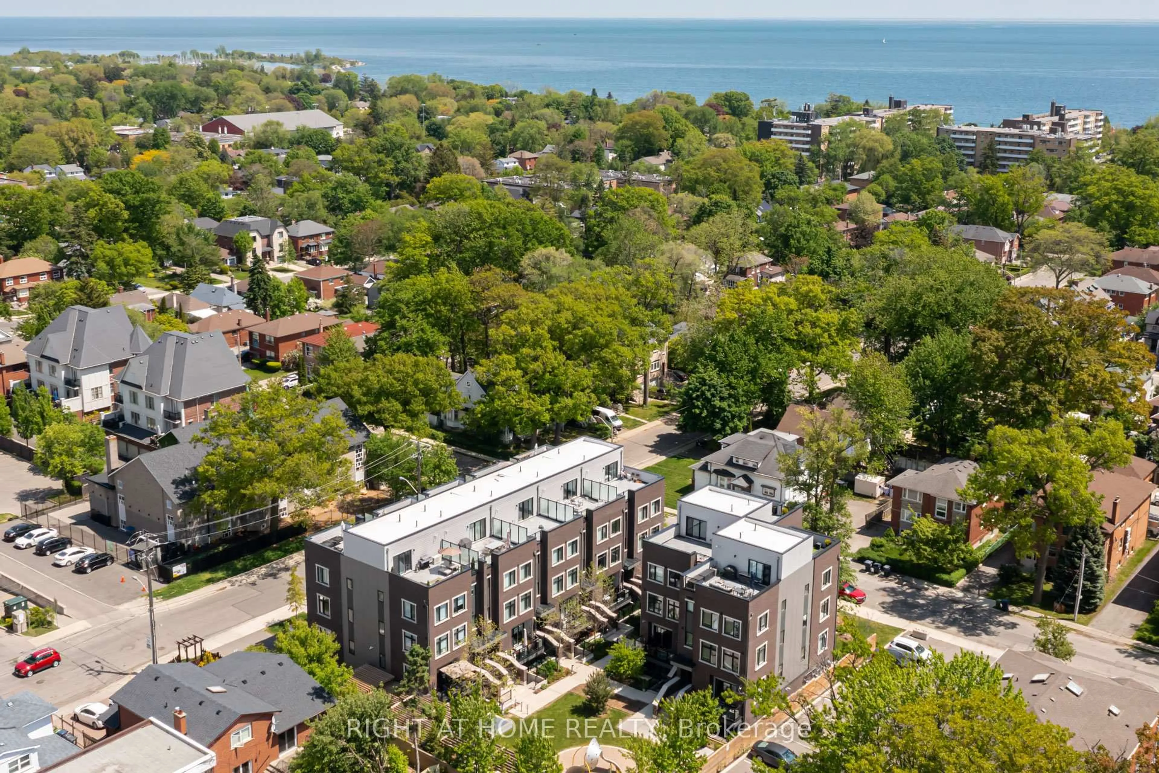 A pic from outside/outdoor area/front of a property/back of a property/a pic from drone, city buildings view from balcony for 66 Long Branch Ave #4, Toronto Ontario M8W 3J4