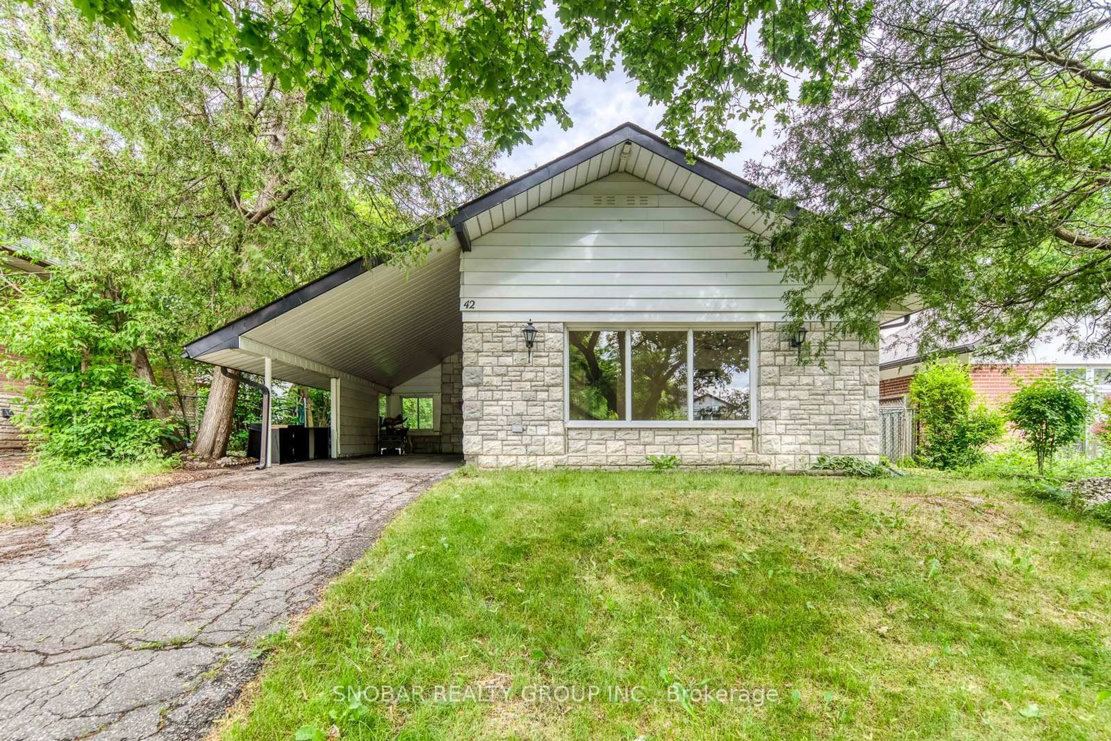 Home with vinyl exterior material, street for 42 Clearbrooke Circ, Toronto Ontario M9W 2E4