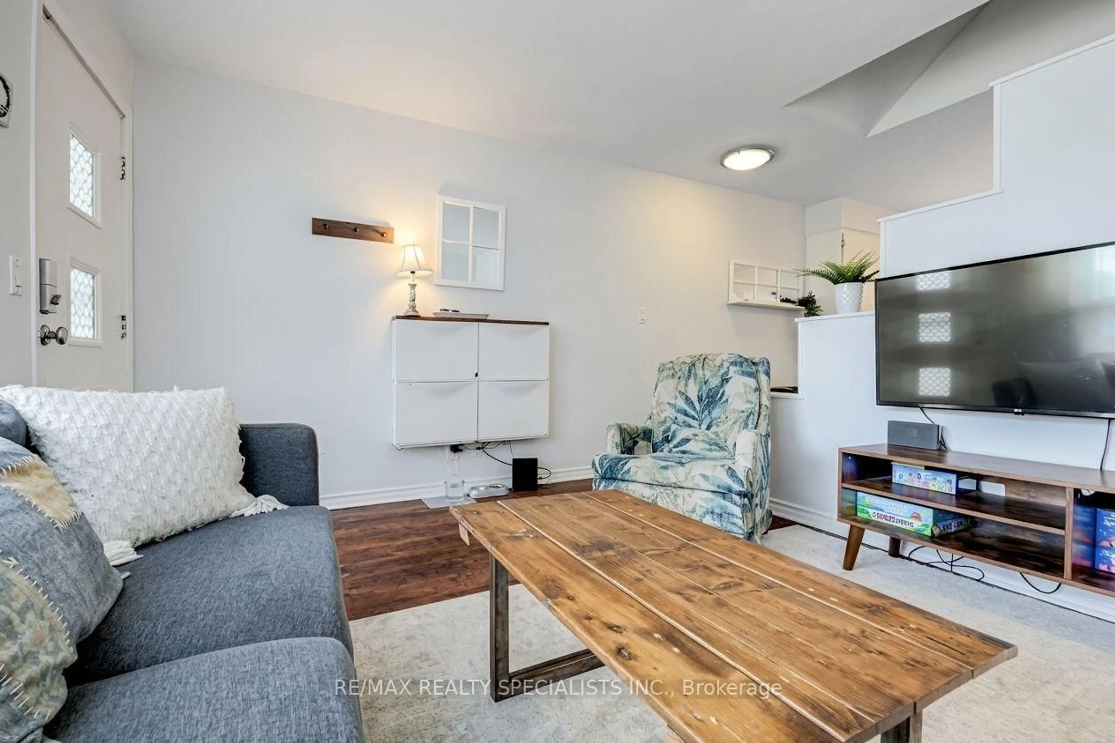 Living room with furniture, wood/laminate floor for 53 Harold St, Toronto Ontario M8Z 3R5