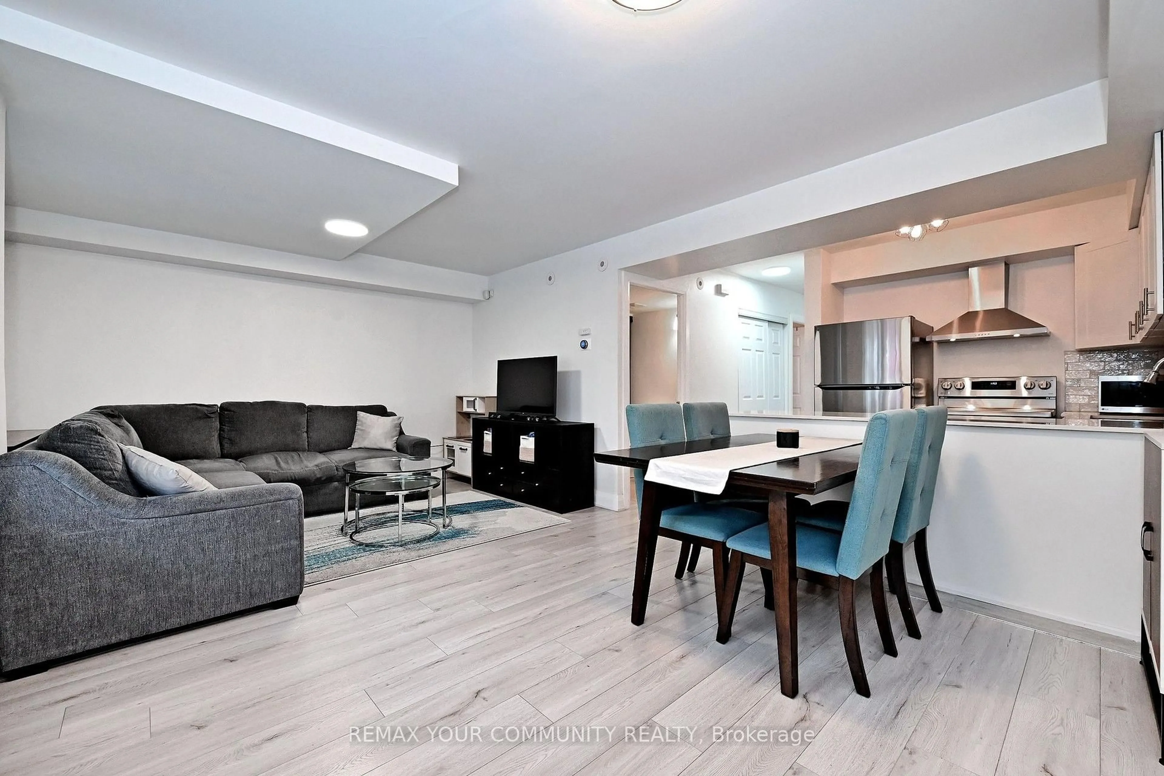 Living room with furniture, unknown for 115 George Appleton Way #1047, Toronto Ontario M3M 0A2