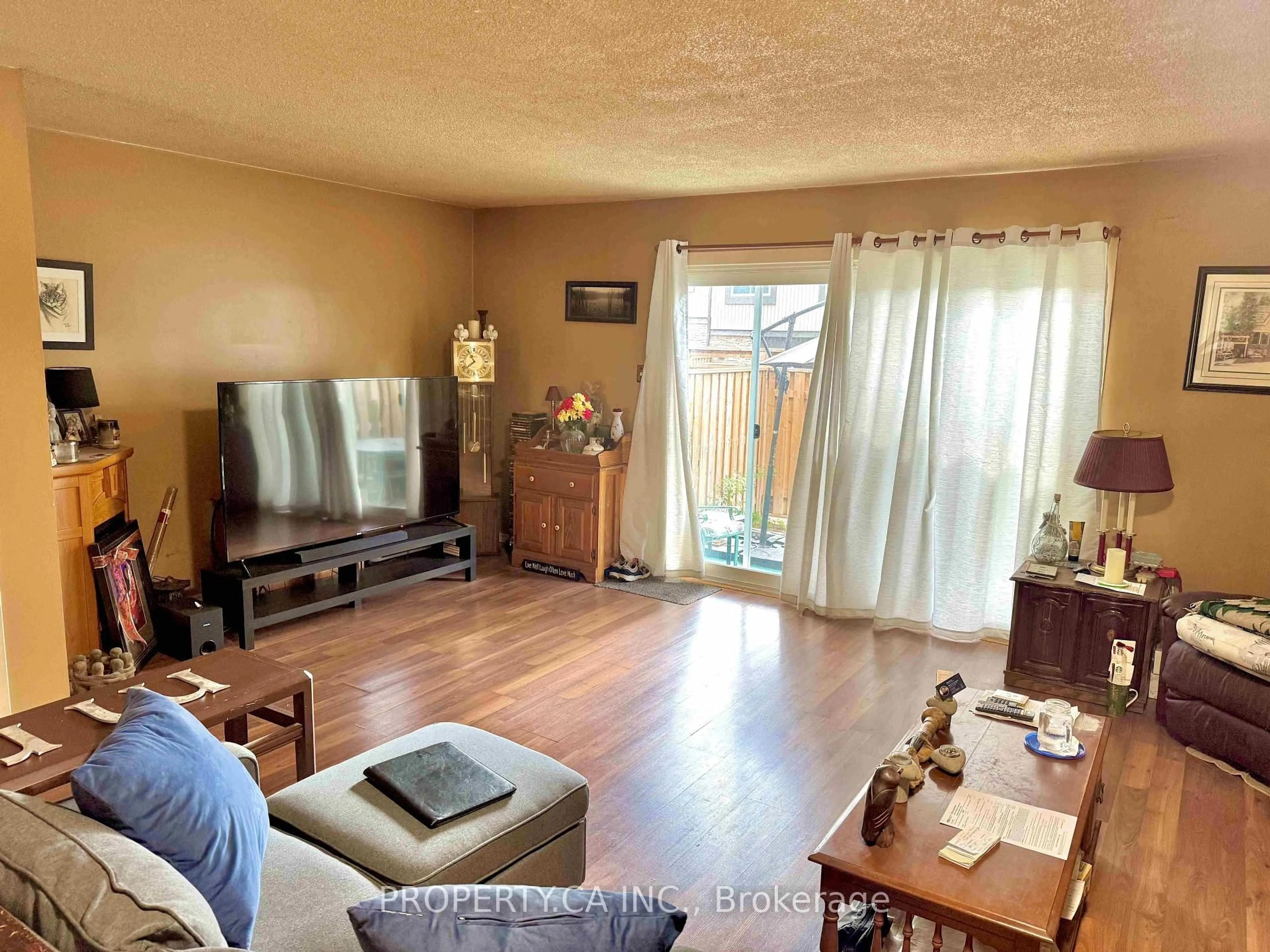 Living room with furniture, wood/laminate floor for 296 Wilson Dr, Milton Ontario L9T 3K2