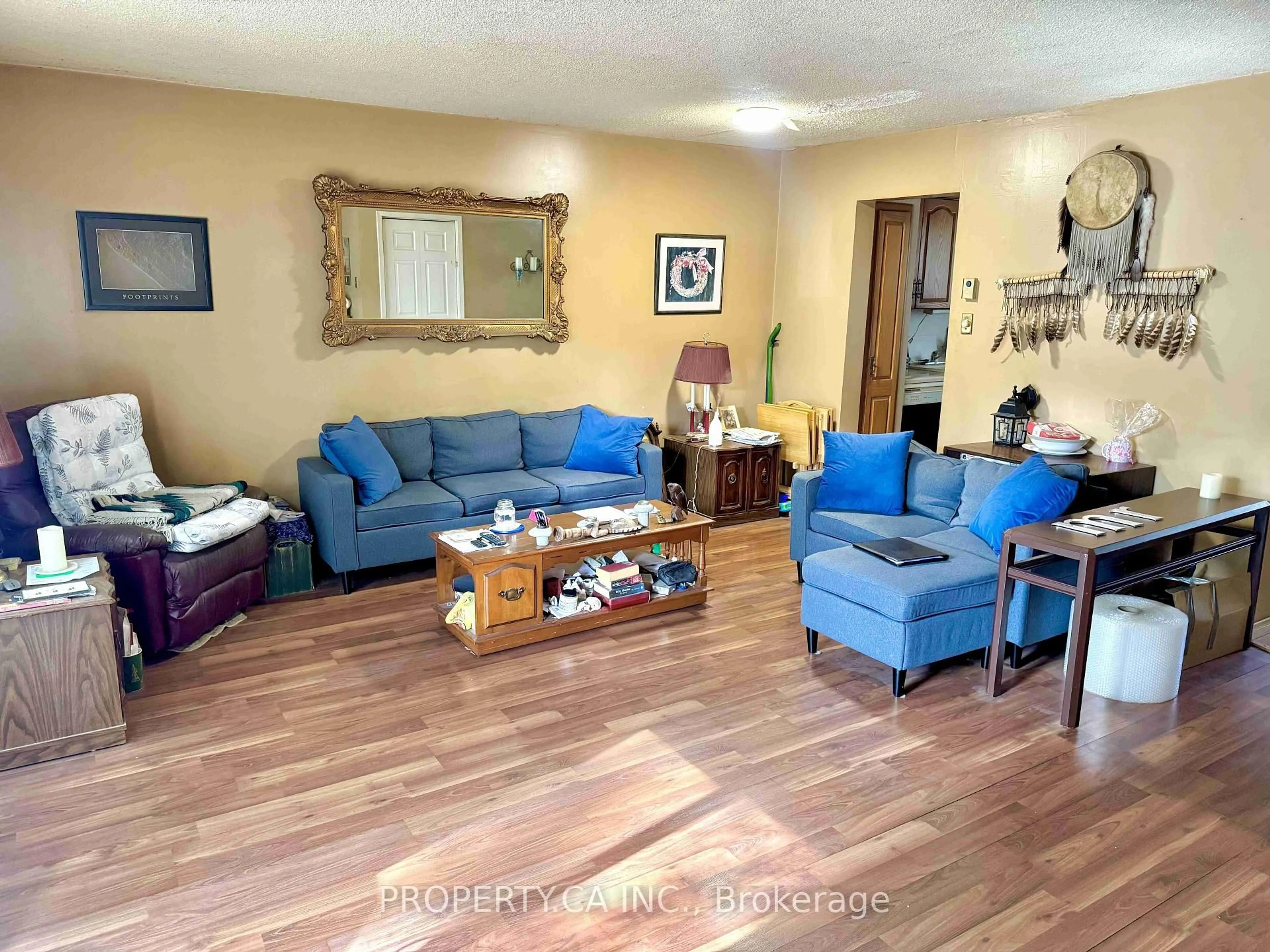 Living room with furniture, wood/laminate floor for 296 Wilson Dr, Milton Ontario L9T 3K2