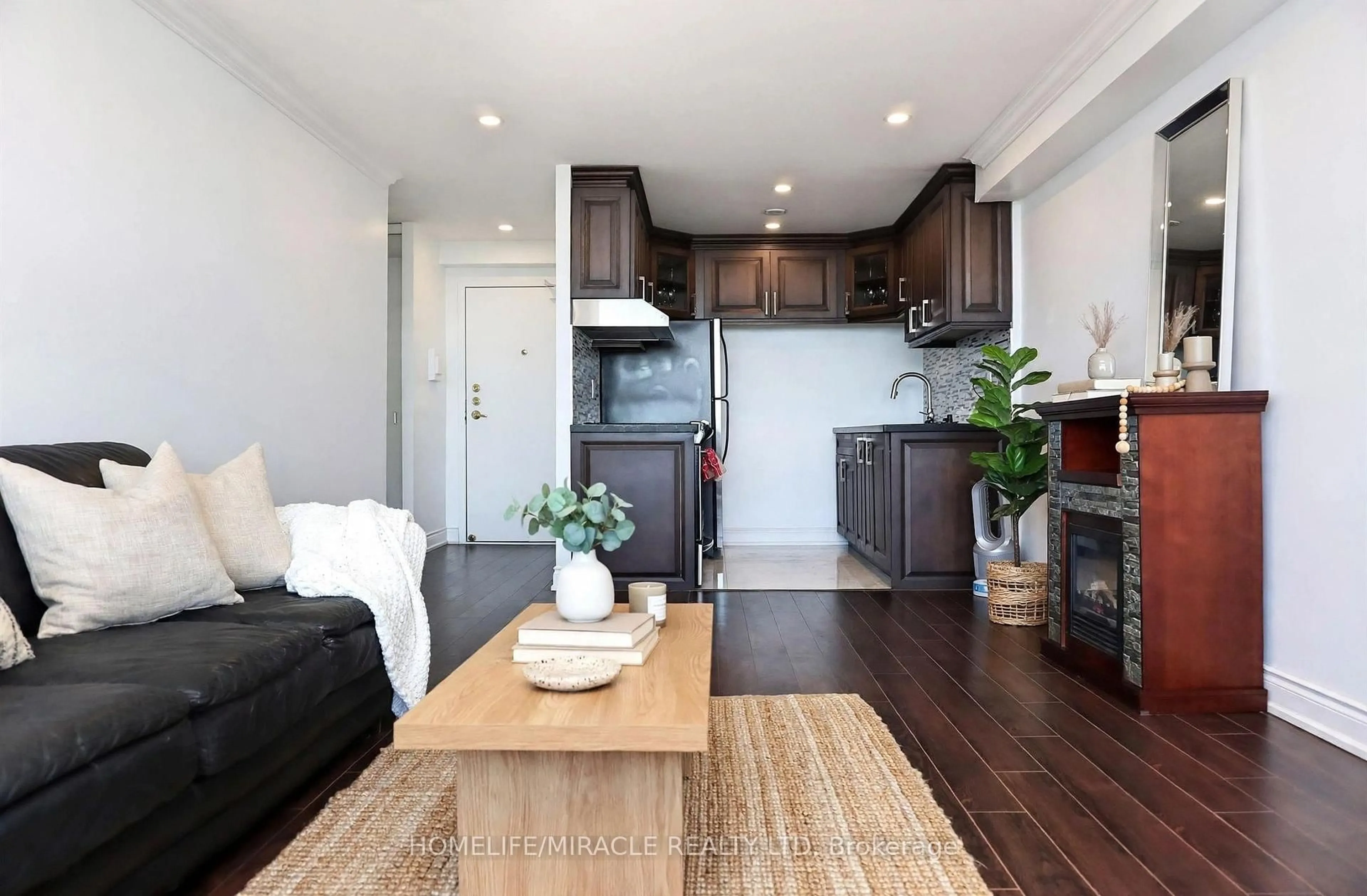 Living room with furniture, wood/laminate floor for 100 Lotherton Ptwy #605, Toronto Ontario M6B 2G8