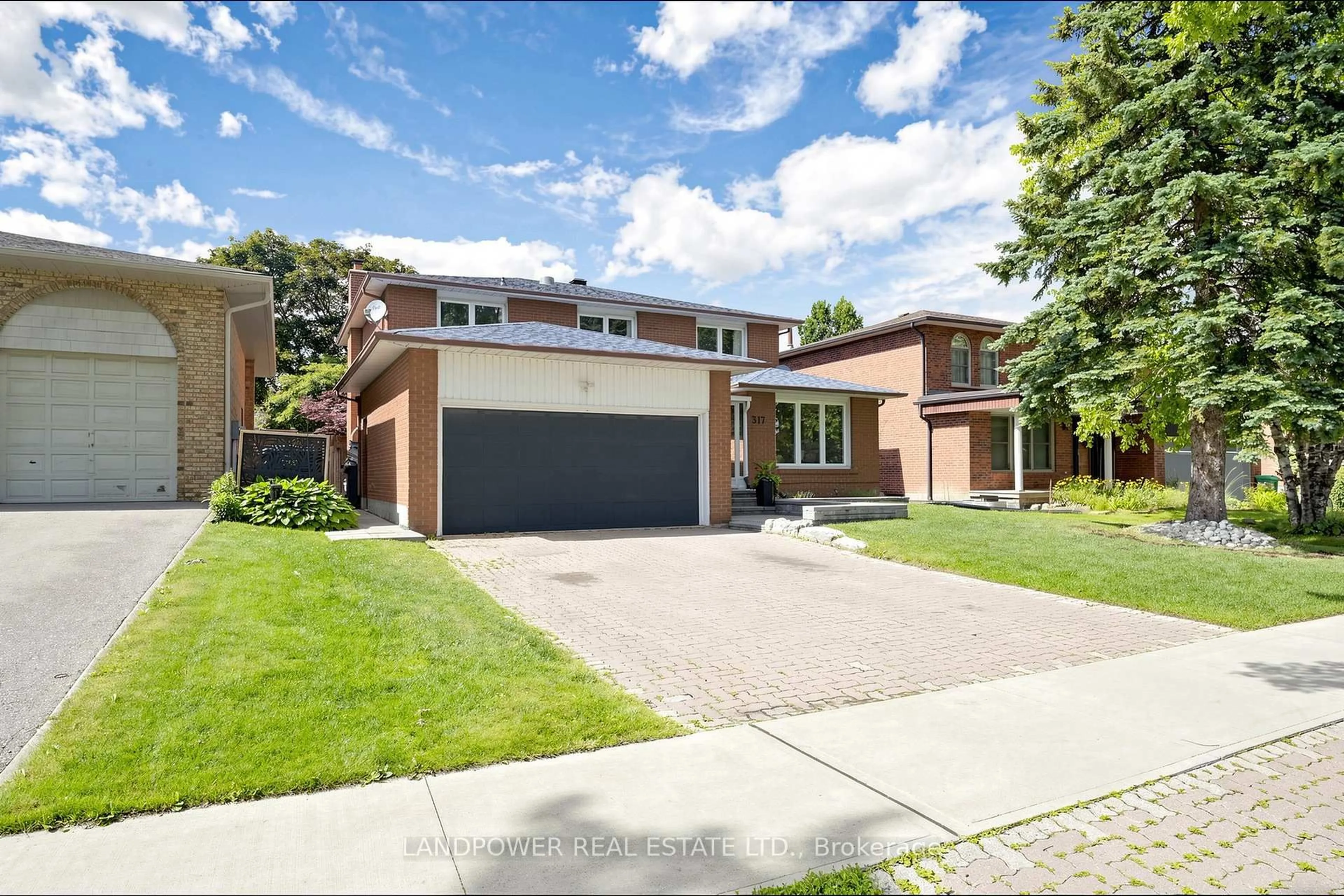 Home with brick exterior material, street for 317 Paisley Blvd, Mississauga Ontario L5B 2S7